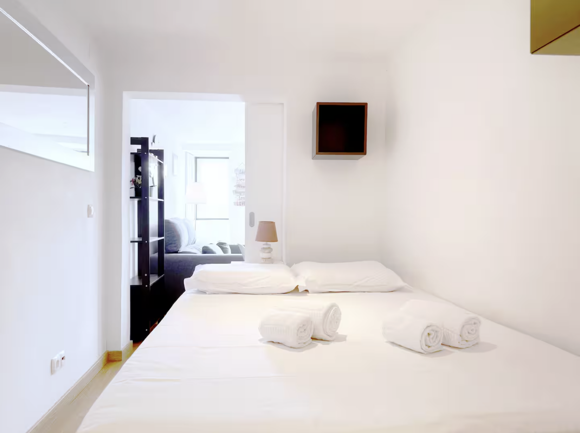 White bedroom with fresh towels