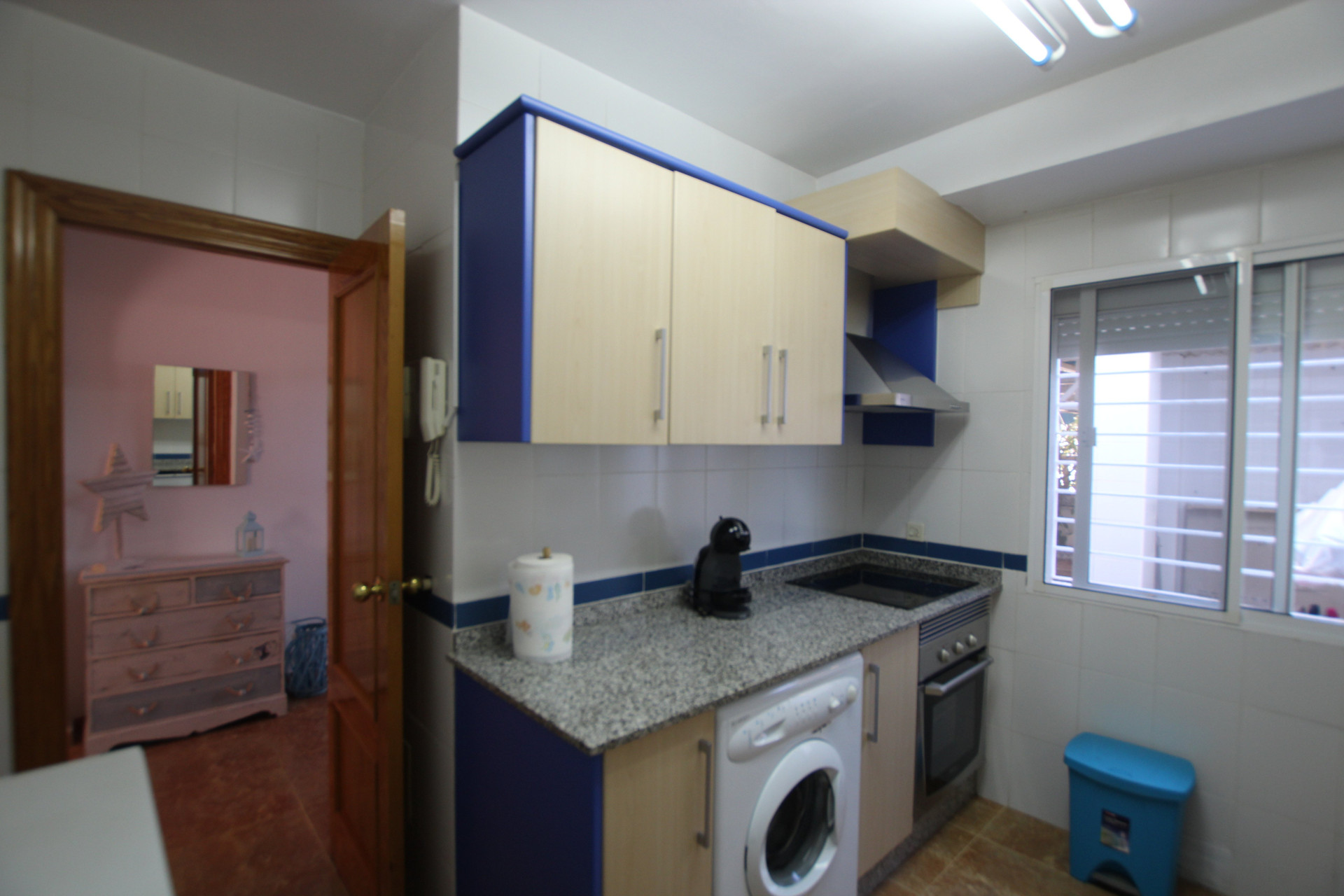 Kitchen with stove and washer