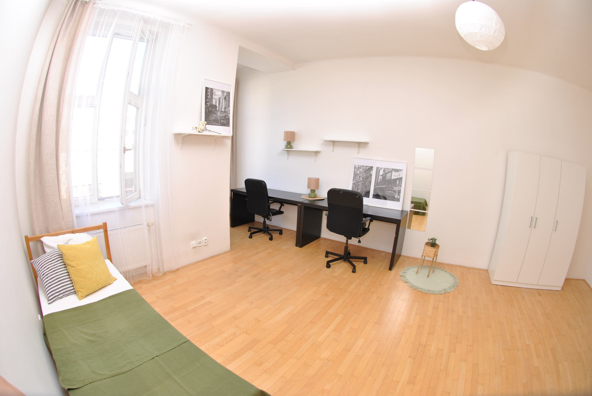 Bedroom with desk workspace and wardrobe