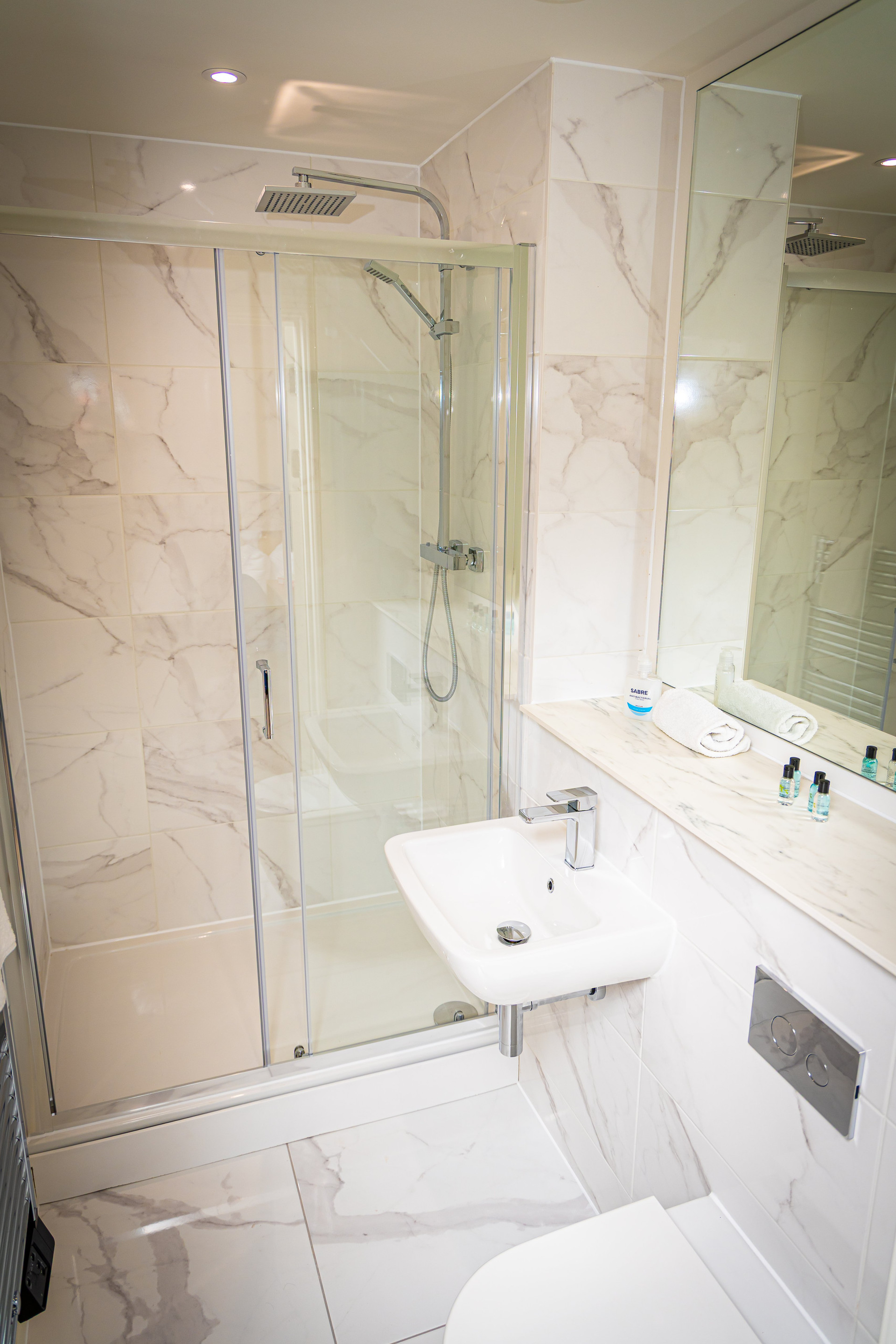 Modern marble tiled bathroom