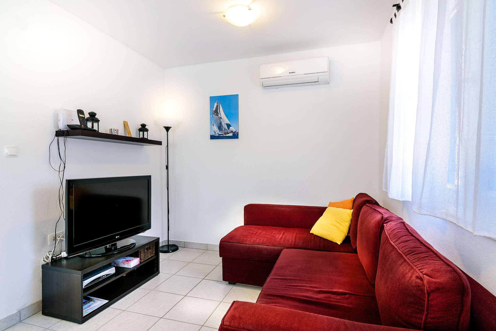 Living room with red sofa