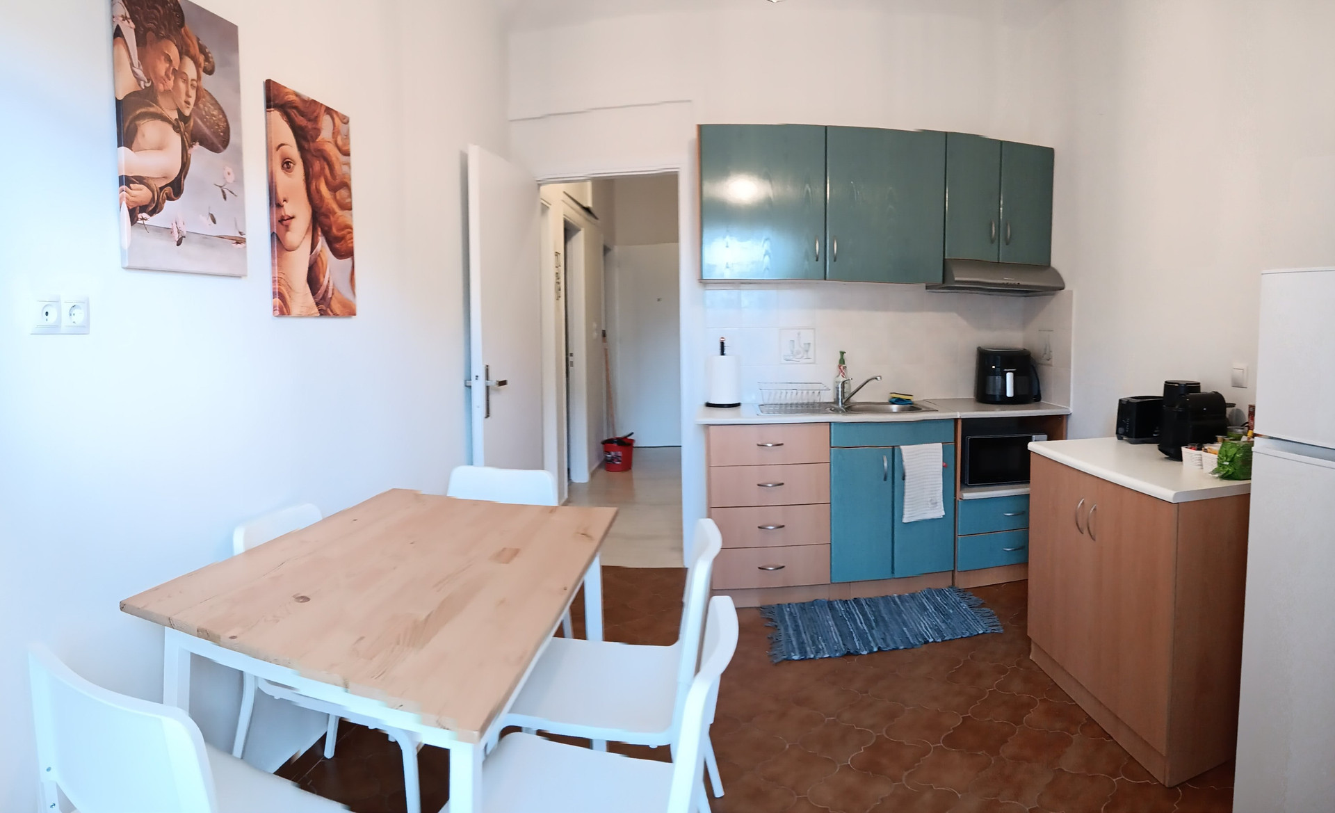 Kitchen with dining table and chairs