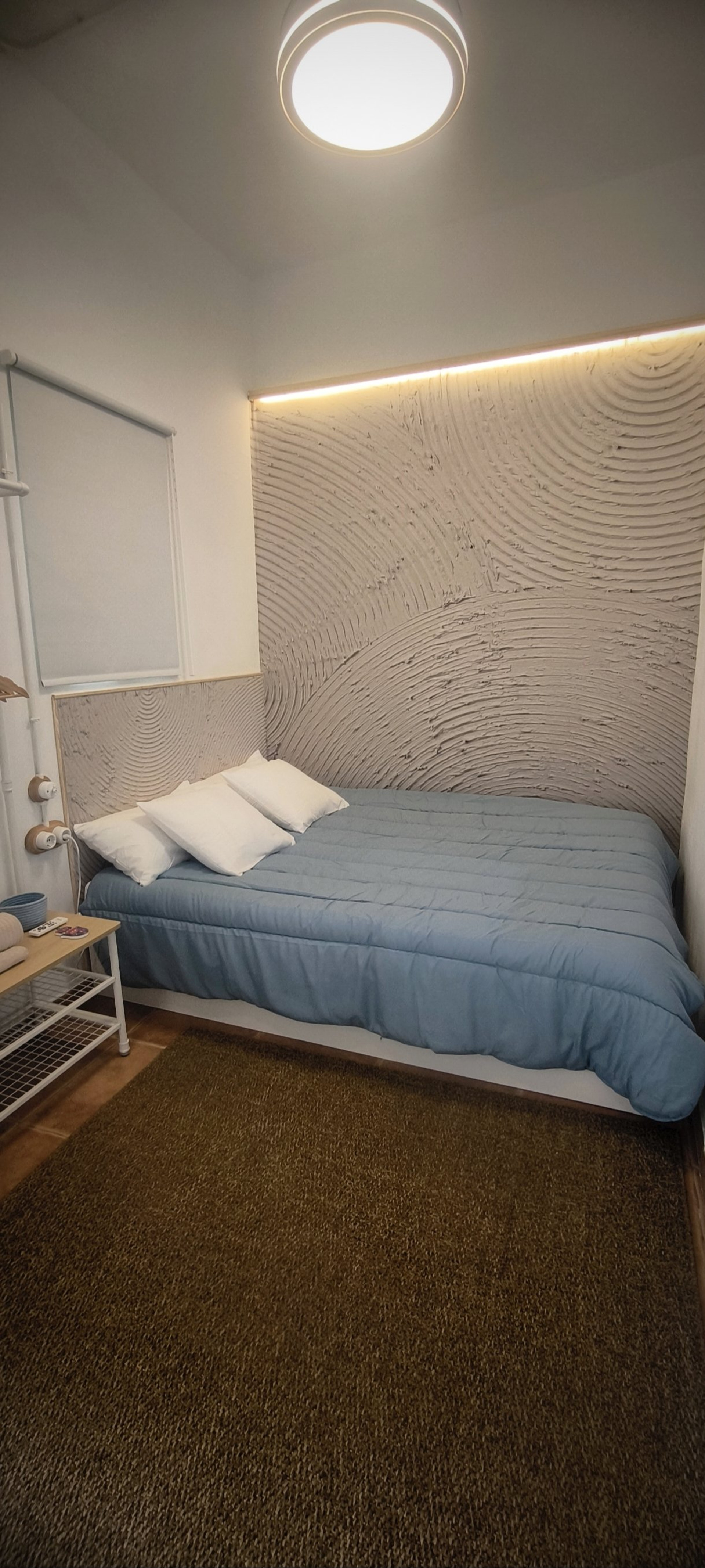 Bedroom with textured headboard