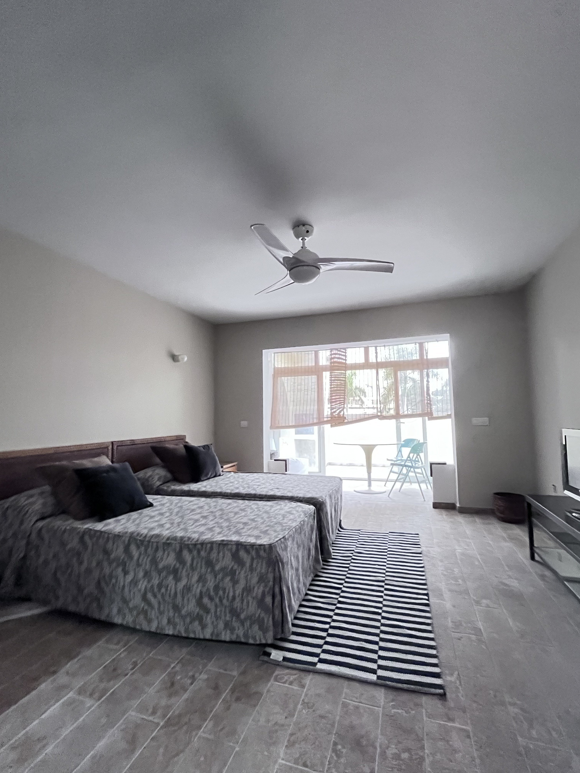 Studio with beds and fan
