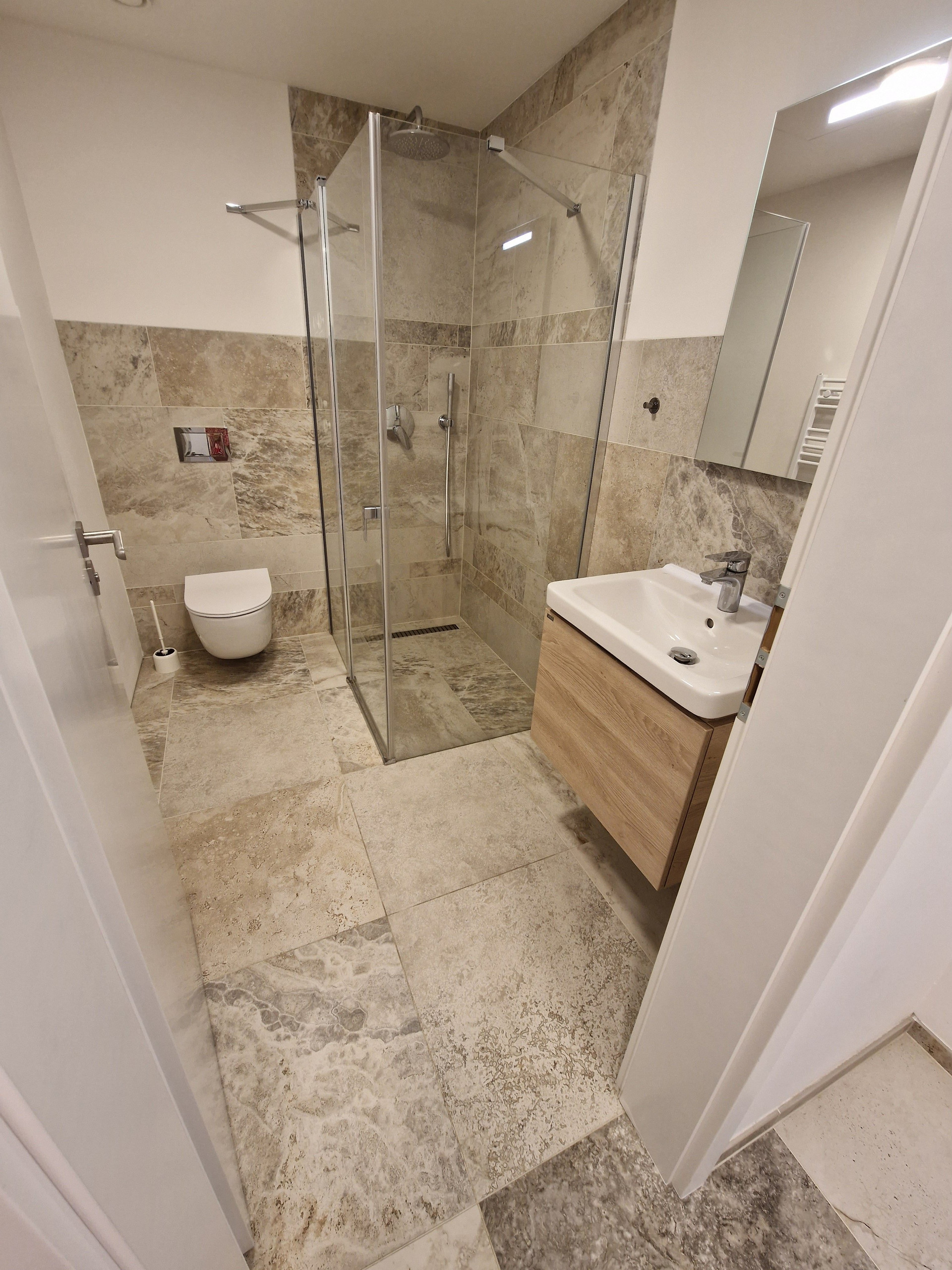 Tiled bathroom with walk-in shower