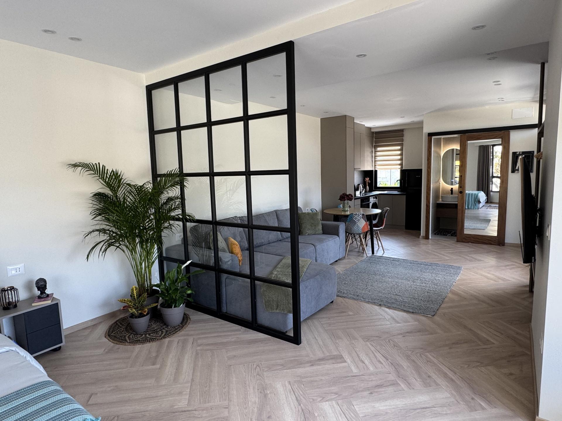 Living room, kitchen, and bathroom view