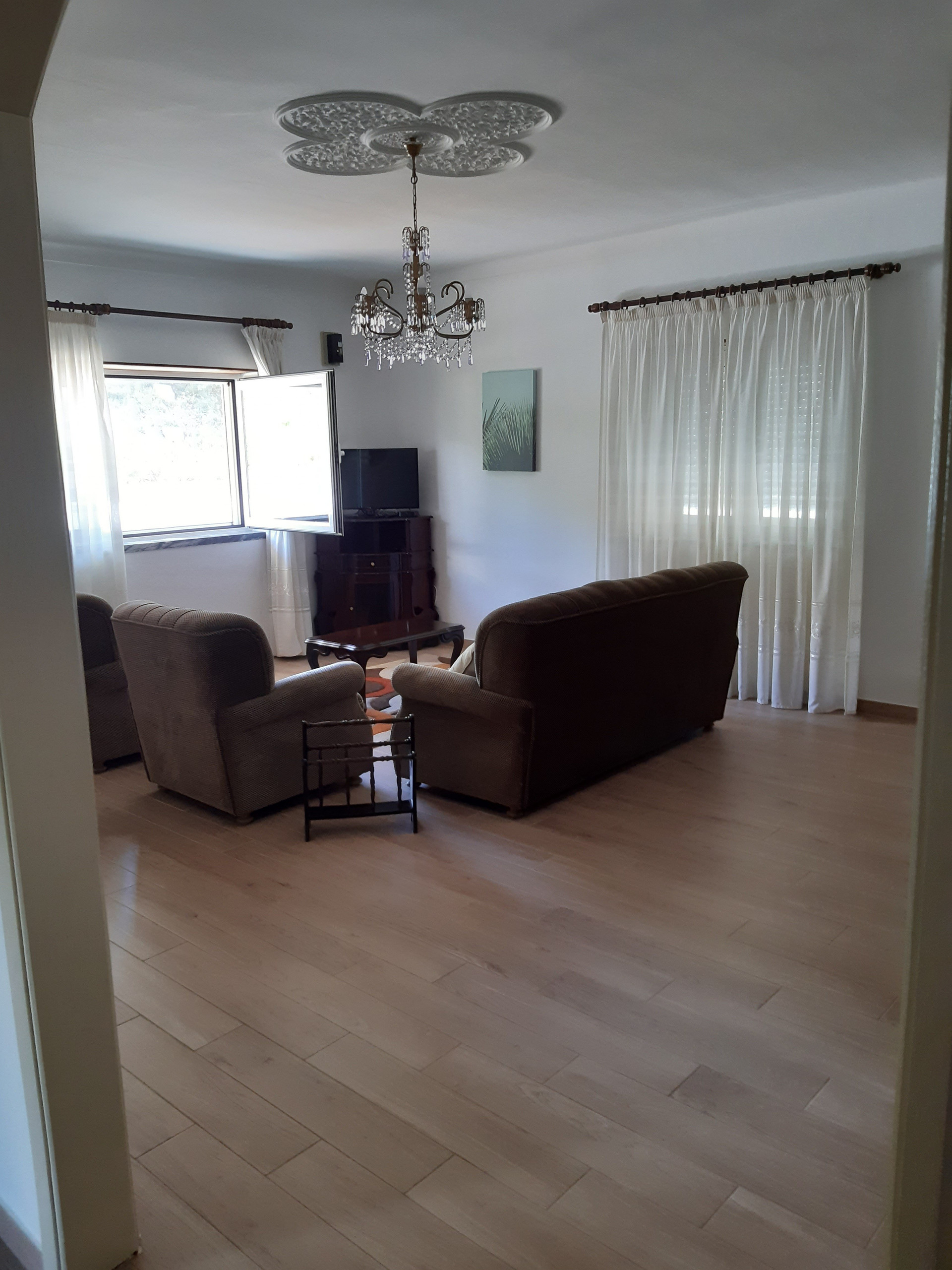 Spacious living room with wooden floor