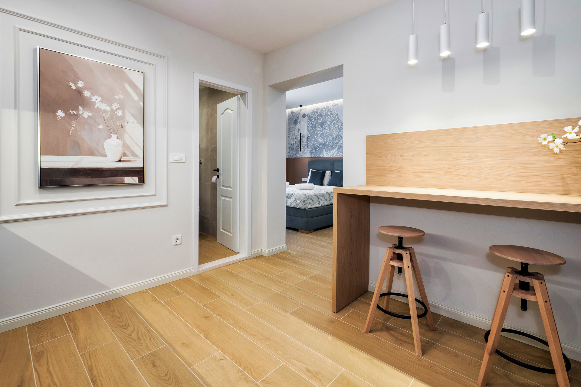 Hallway with bar stools, bedroom view