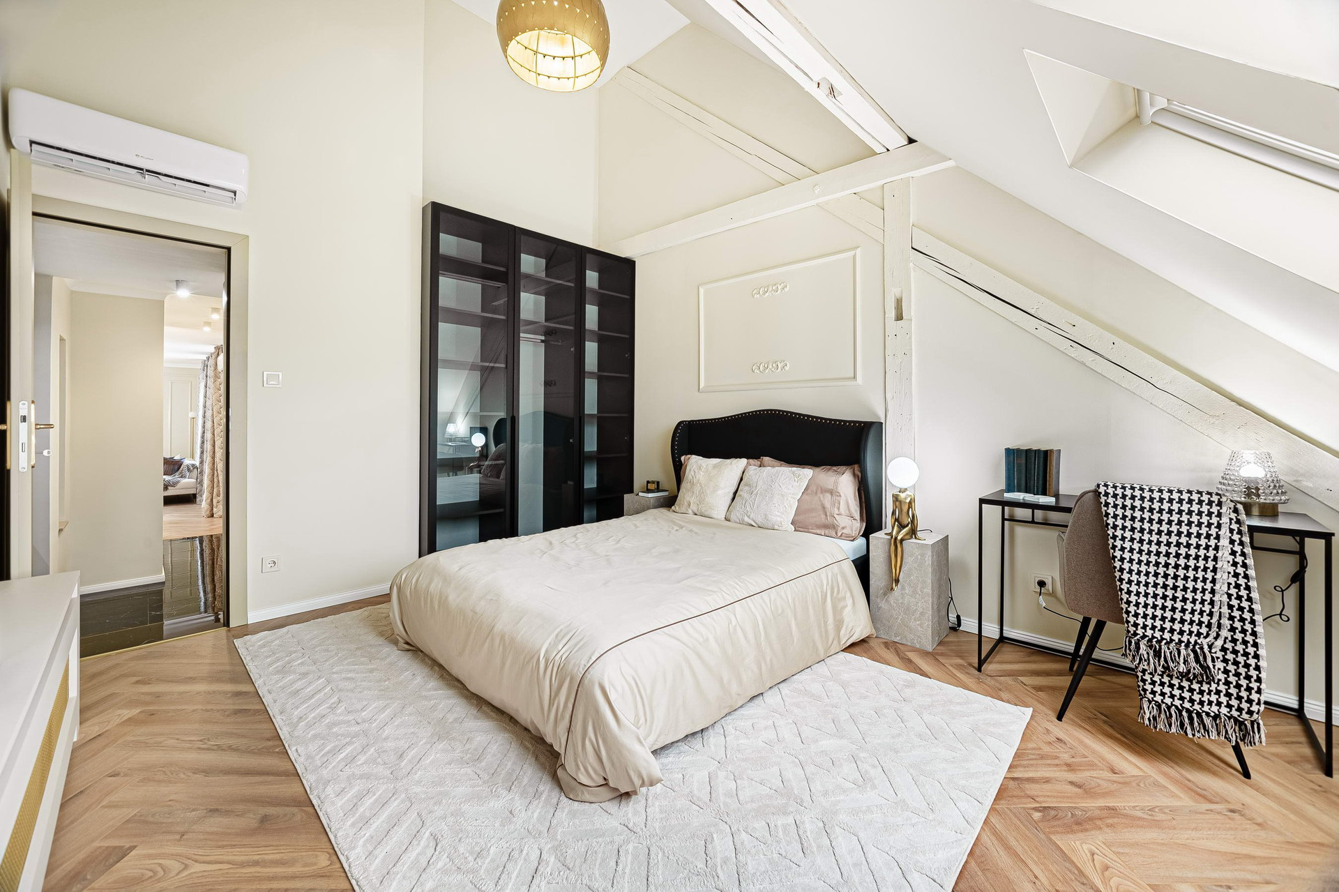 Loft bedroom with sloped ceiling