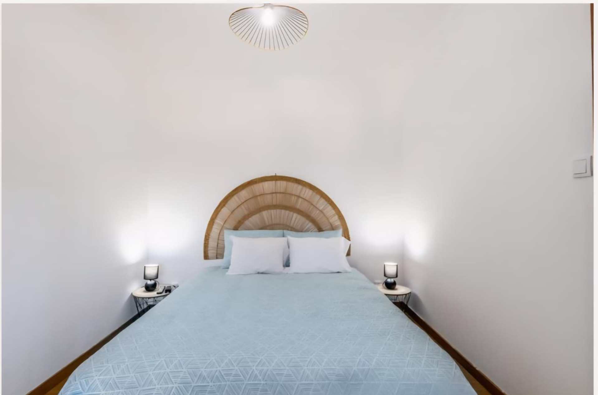 Bedroom with round headboard