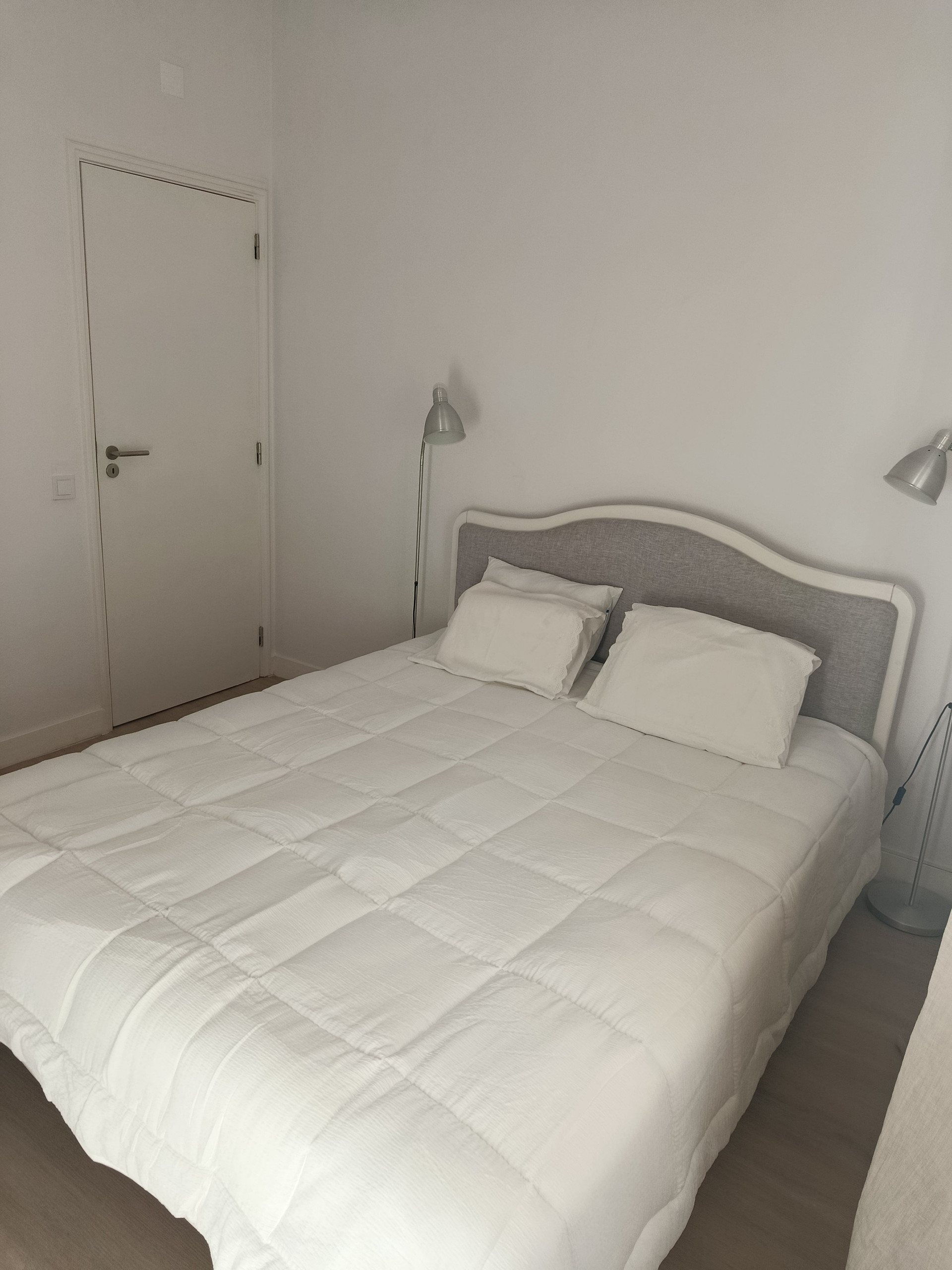 Bedroom with upholstered headboard bed