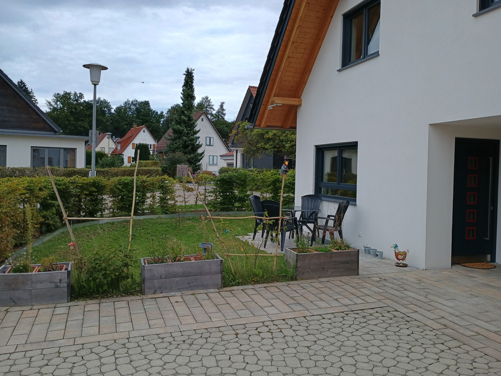 The flat over 2 floors, patio at the front, plus a driveway
