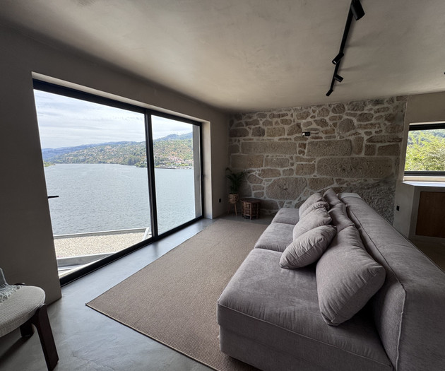 Living room with sofa, panoramic window