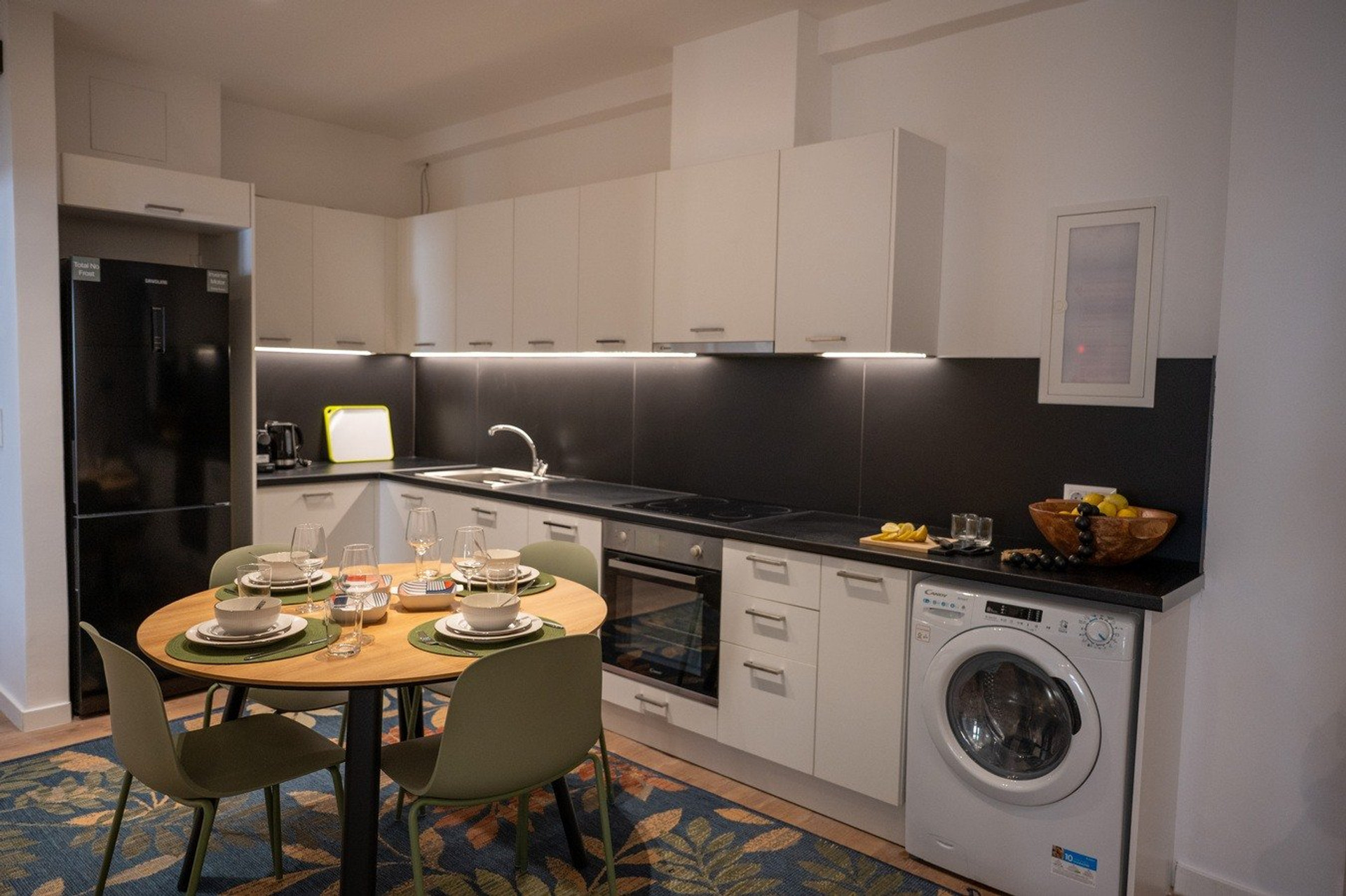 Kitchen with dining table and appliances