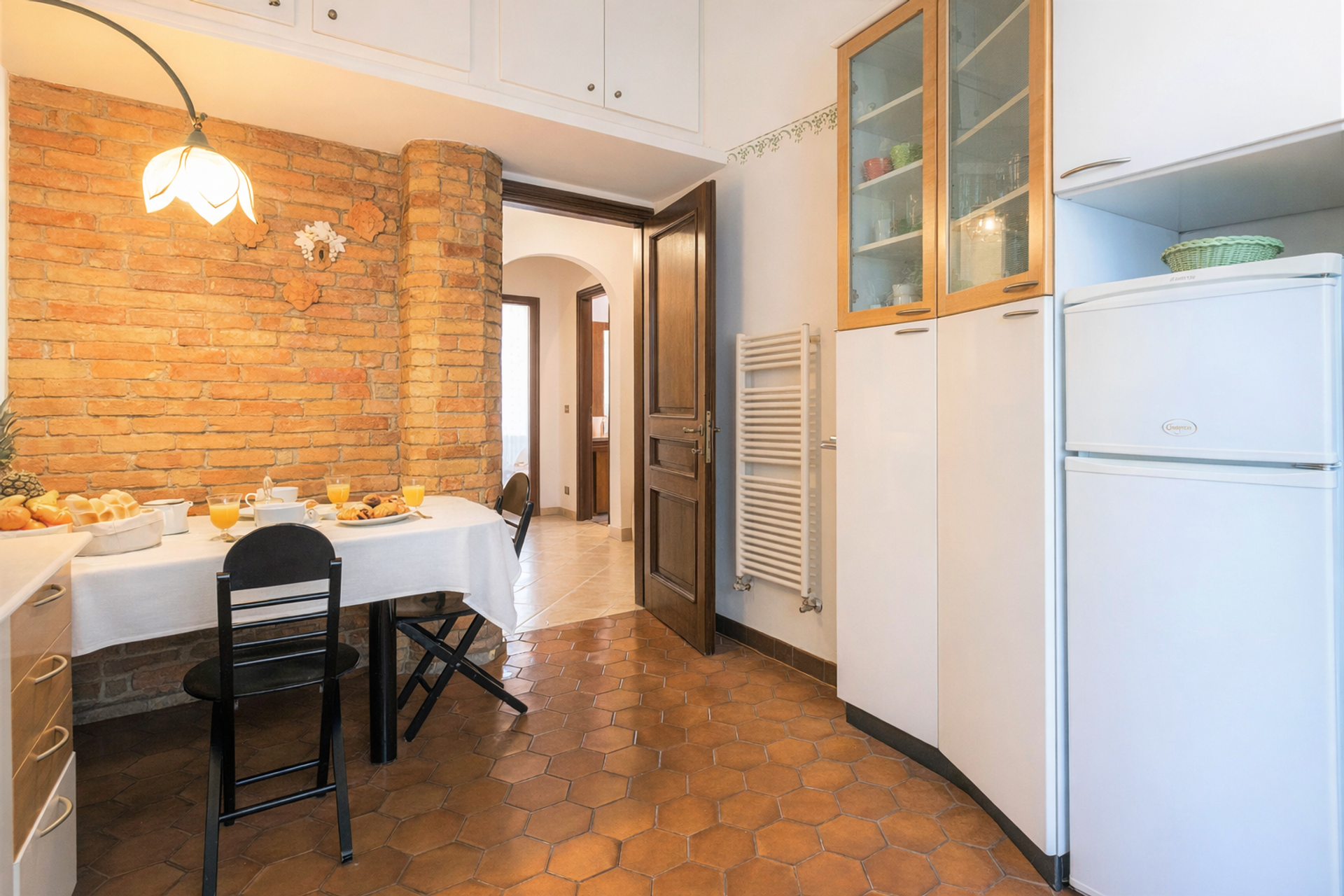Kitchen with brick wall dining