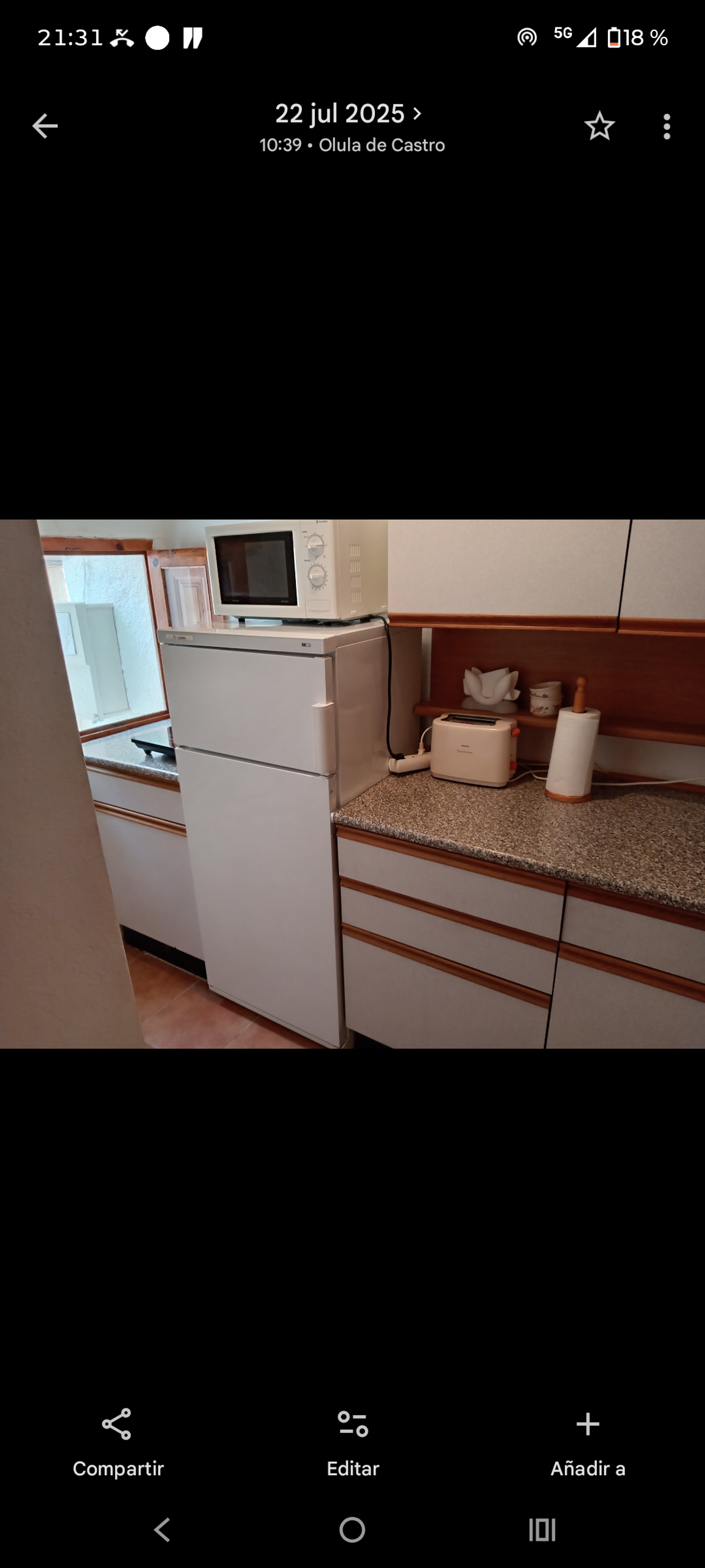 Kitchen with fridge and microwave