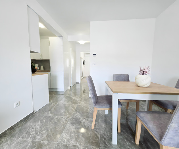 Hallway with kitchen and dining view