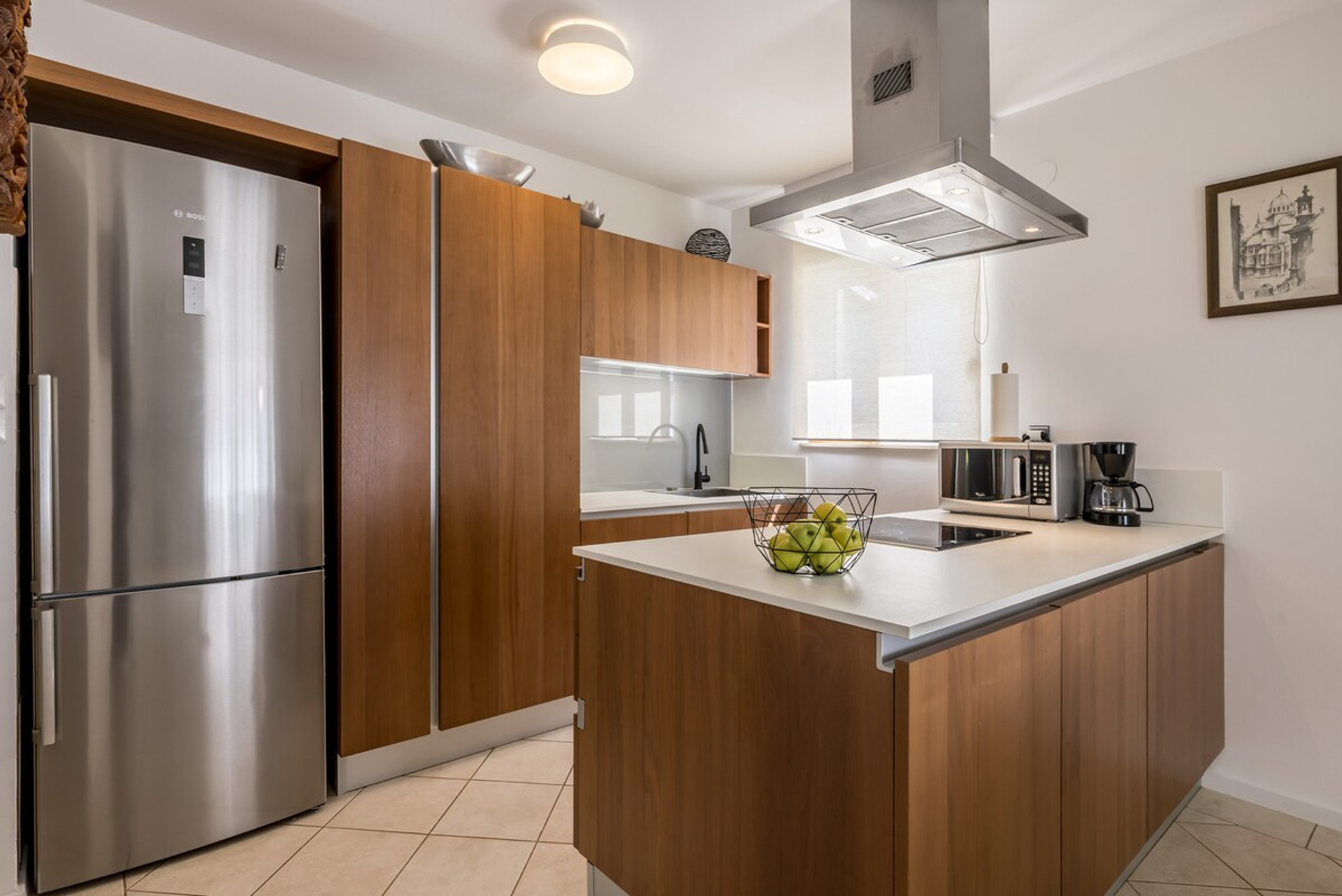 Open-concept kitchen that seamlessly flows into the living area, creating a welcoming space for gathering and socializing