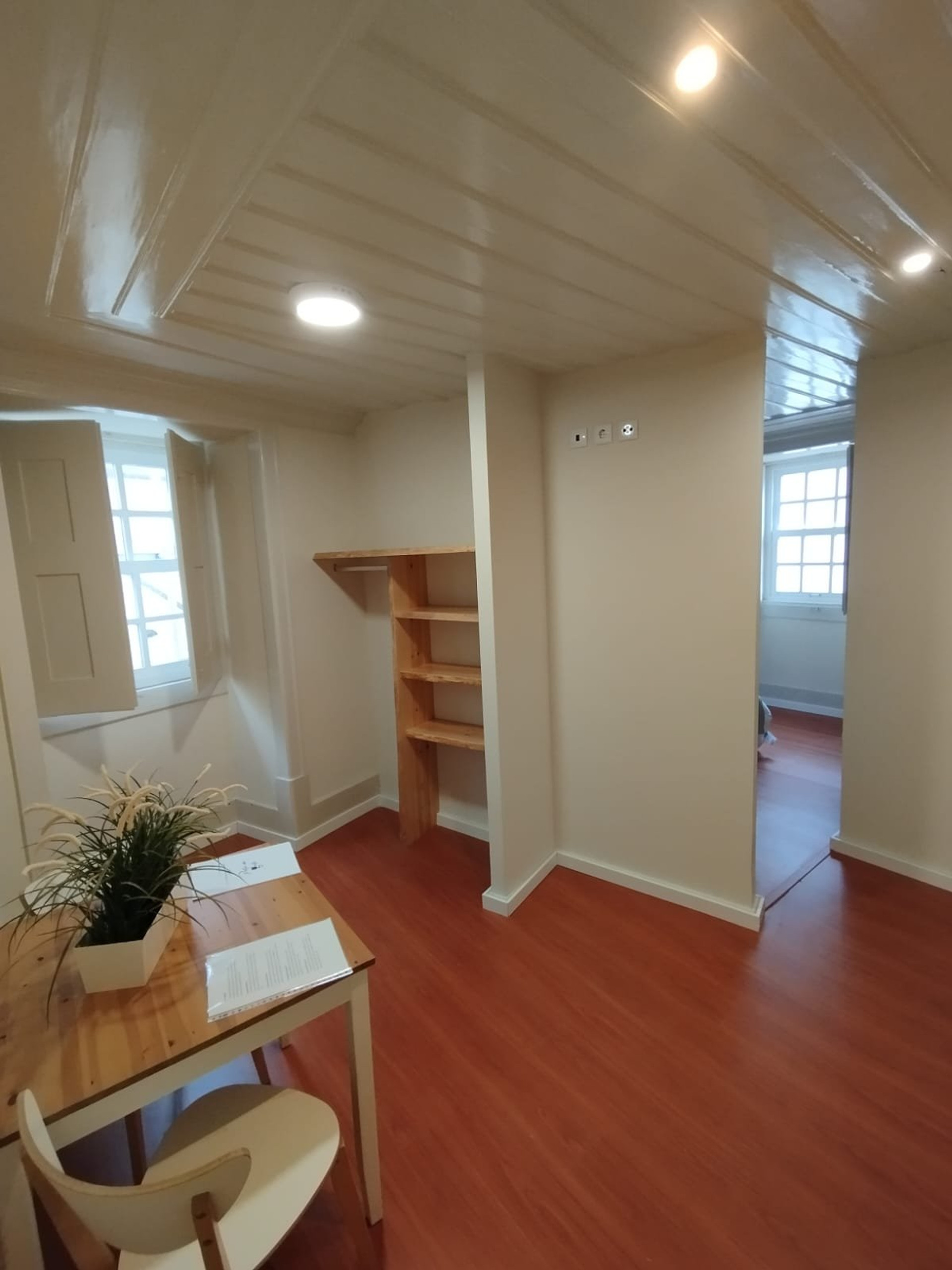 Open living space with shelving