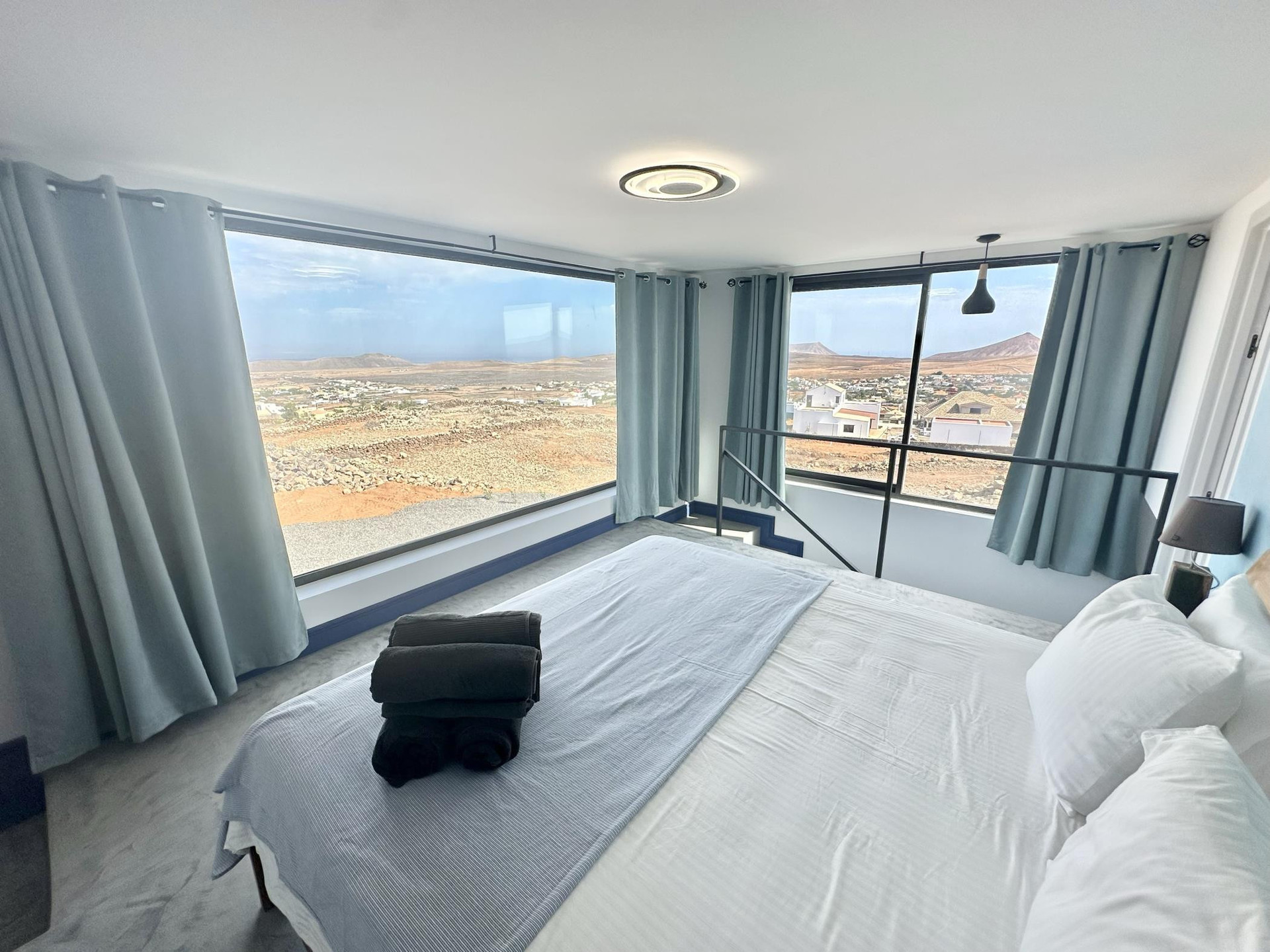 Master bedroom panoramic landscape windows