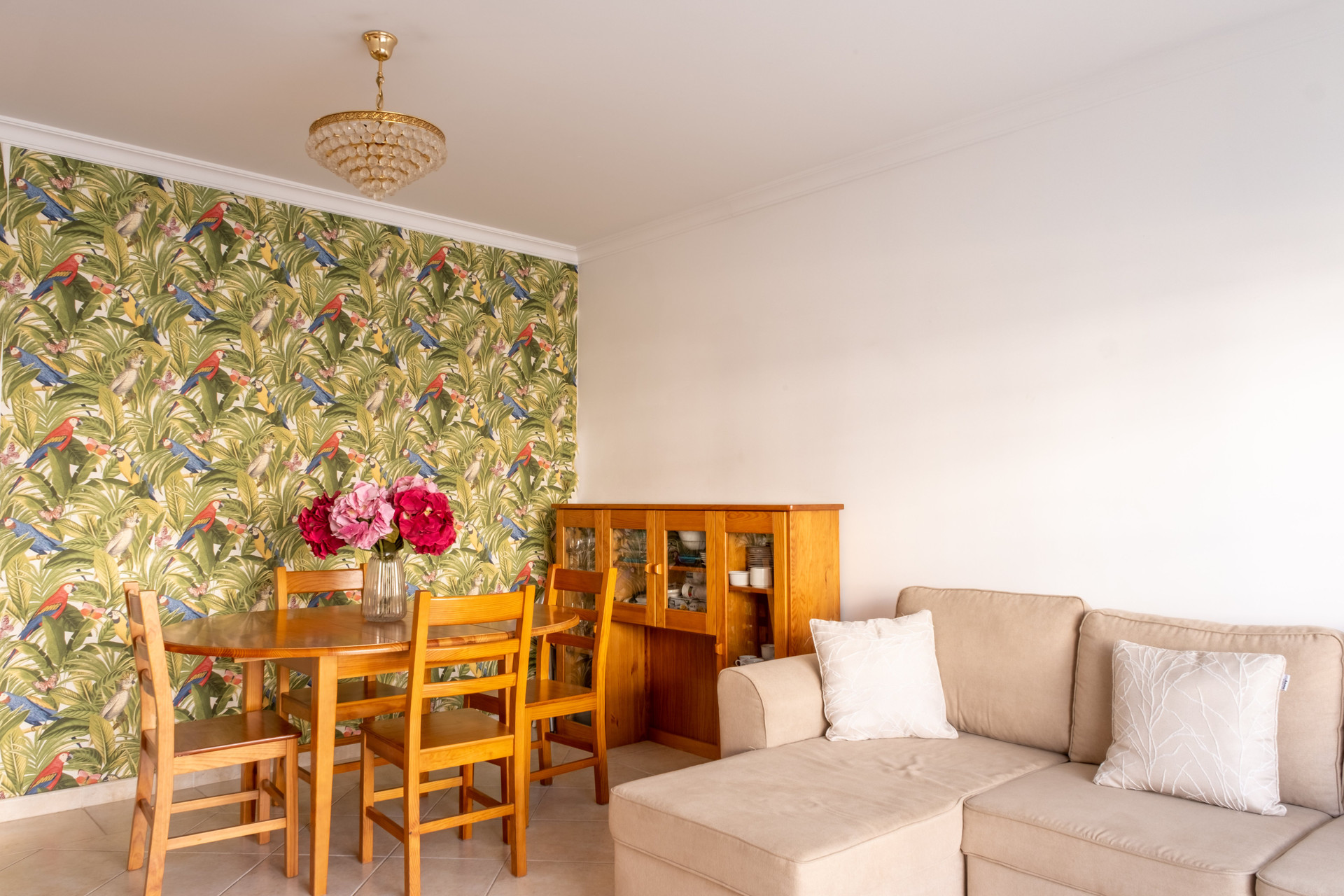 Dining area with parrot wallpaper