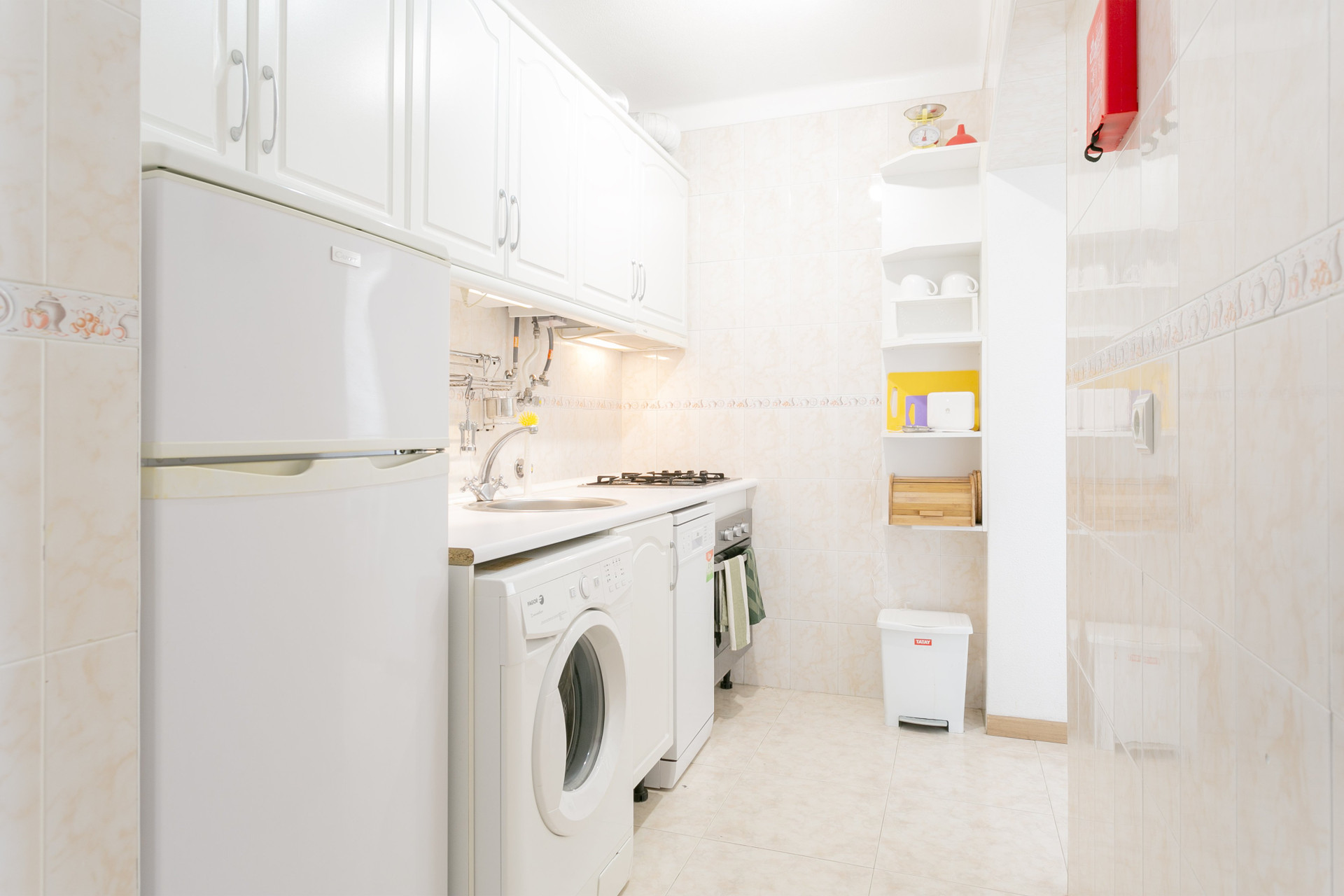 Compact kitchen with laundry appliances