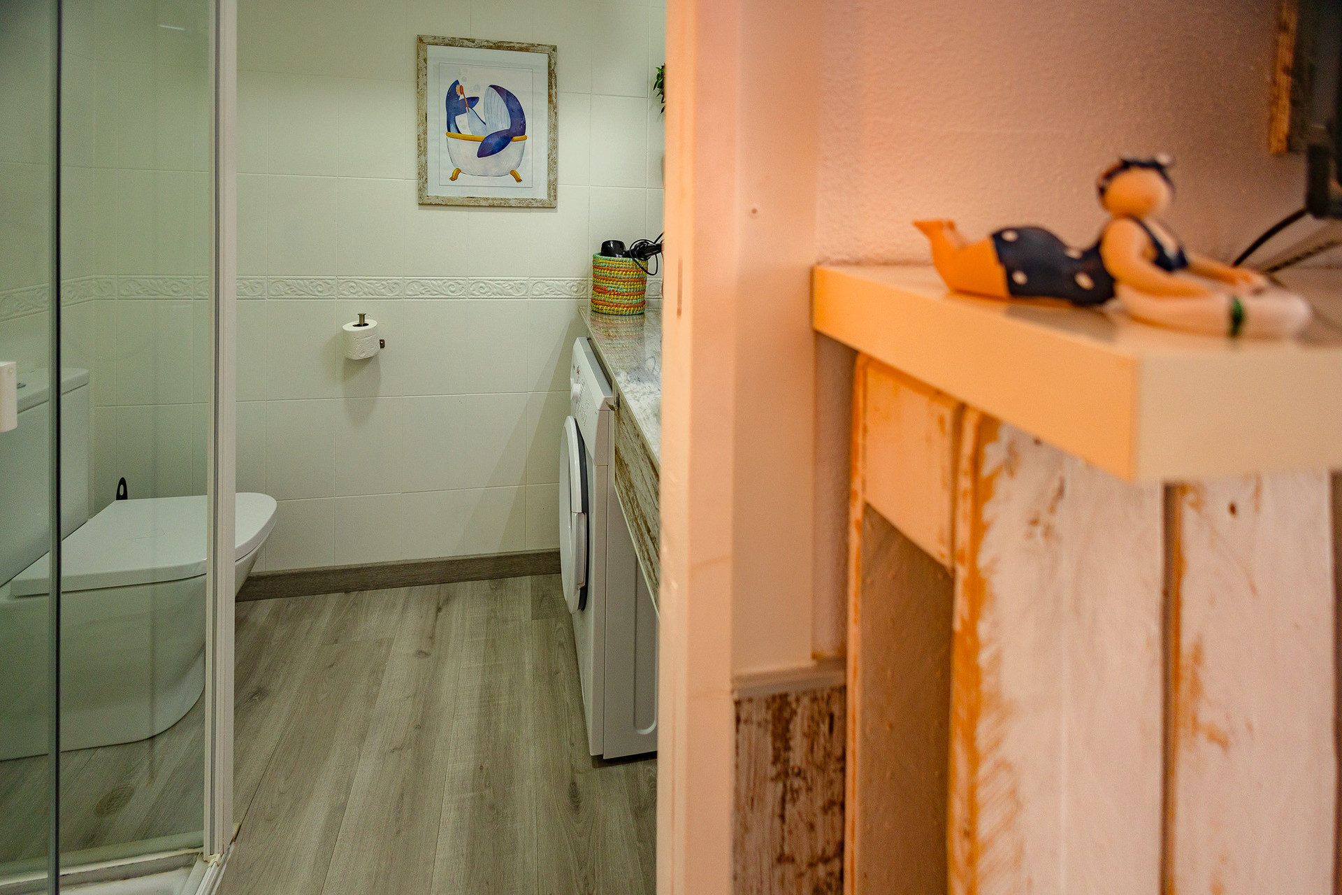 Bathroom with shower and laundry