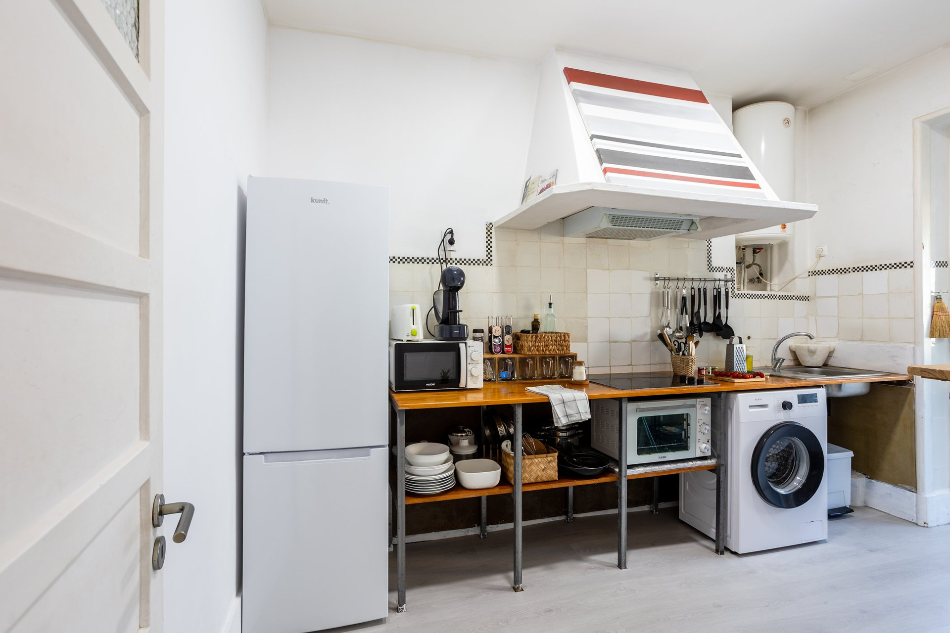 Kitchen with fridge and hob