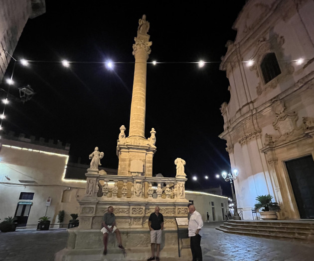 Illuminated column in night square