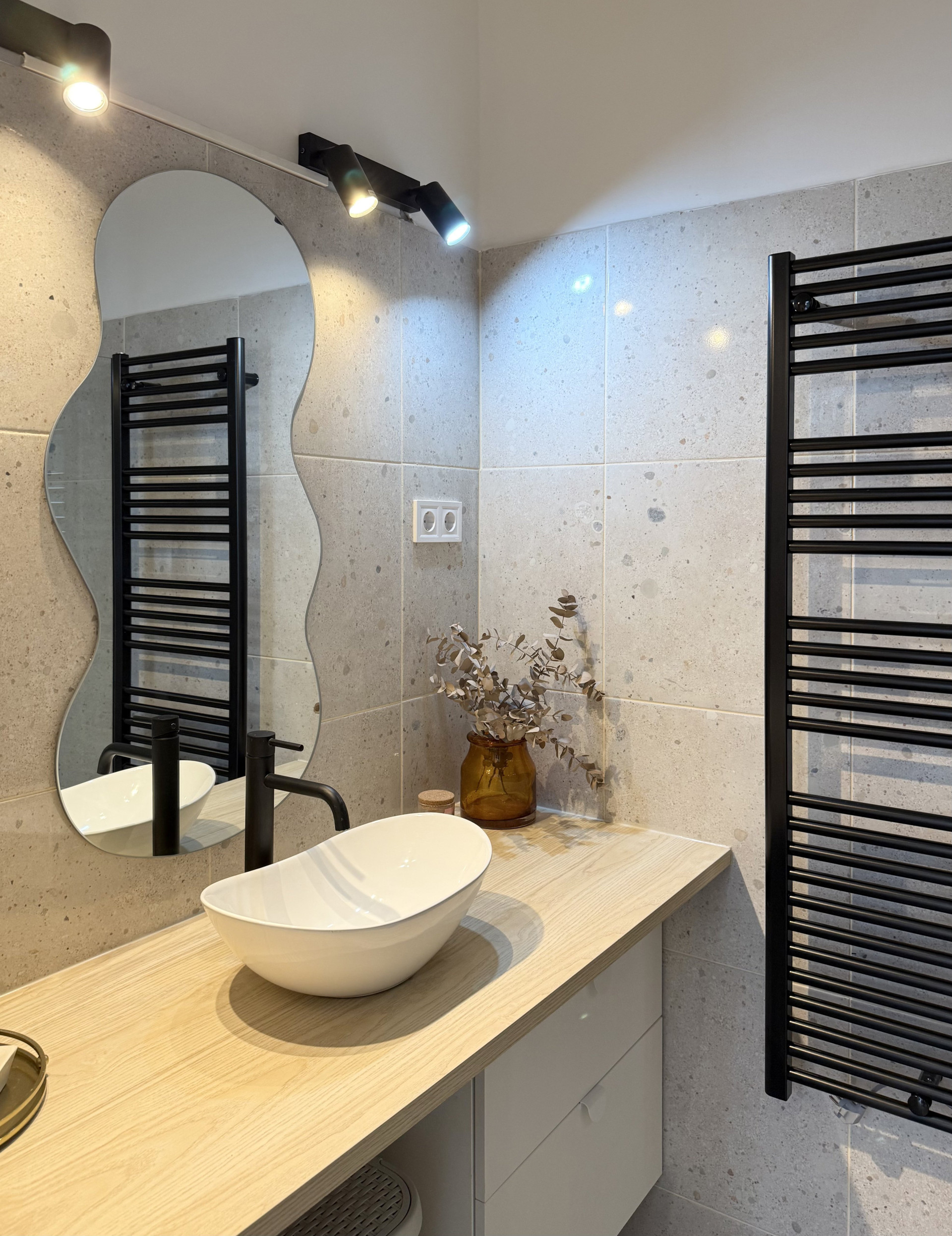 Bathroom vanity with wavy mirror