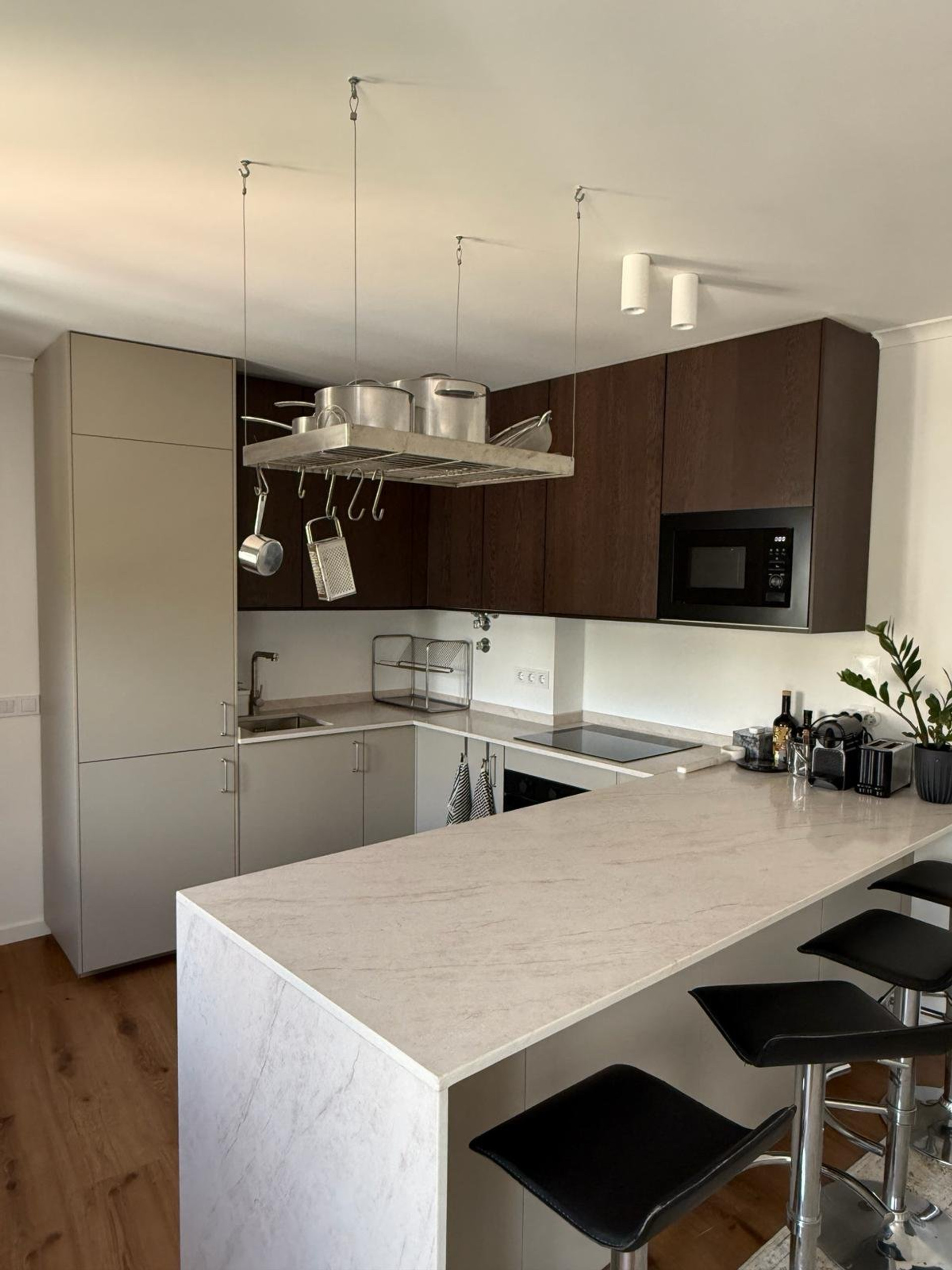 Kitchen with marble island and bar stools
