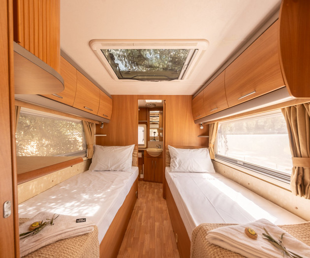 Twin bedroom with bathroom beyond