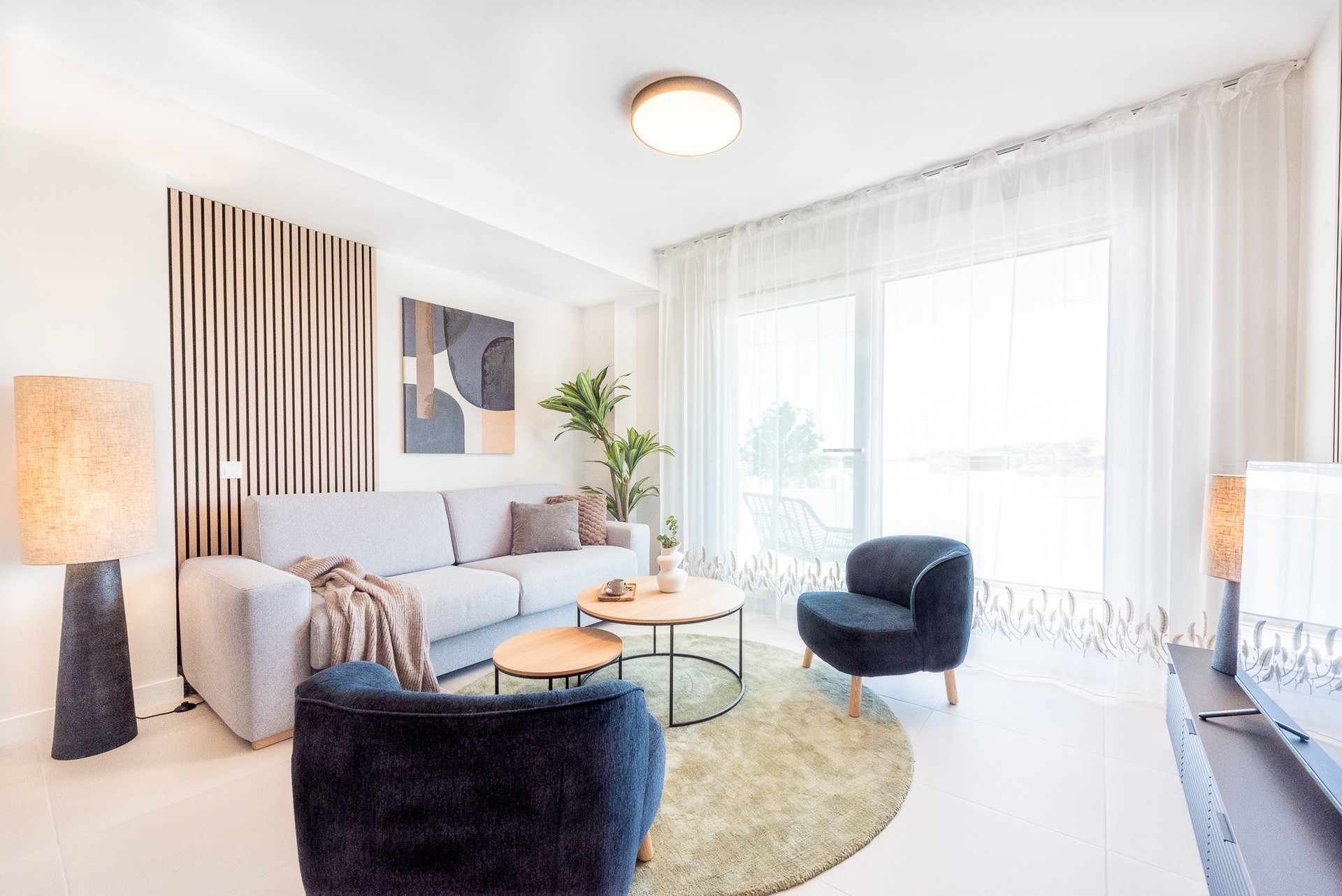 Bright living room with armchairs