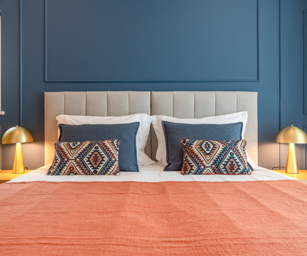 Bed with patterned pillows