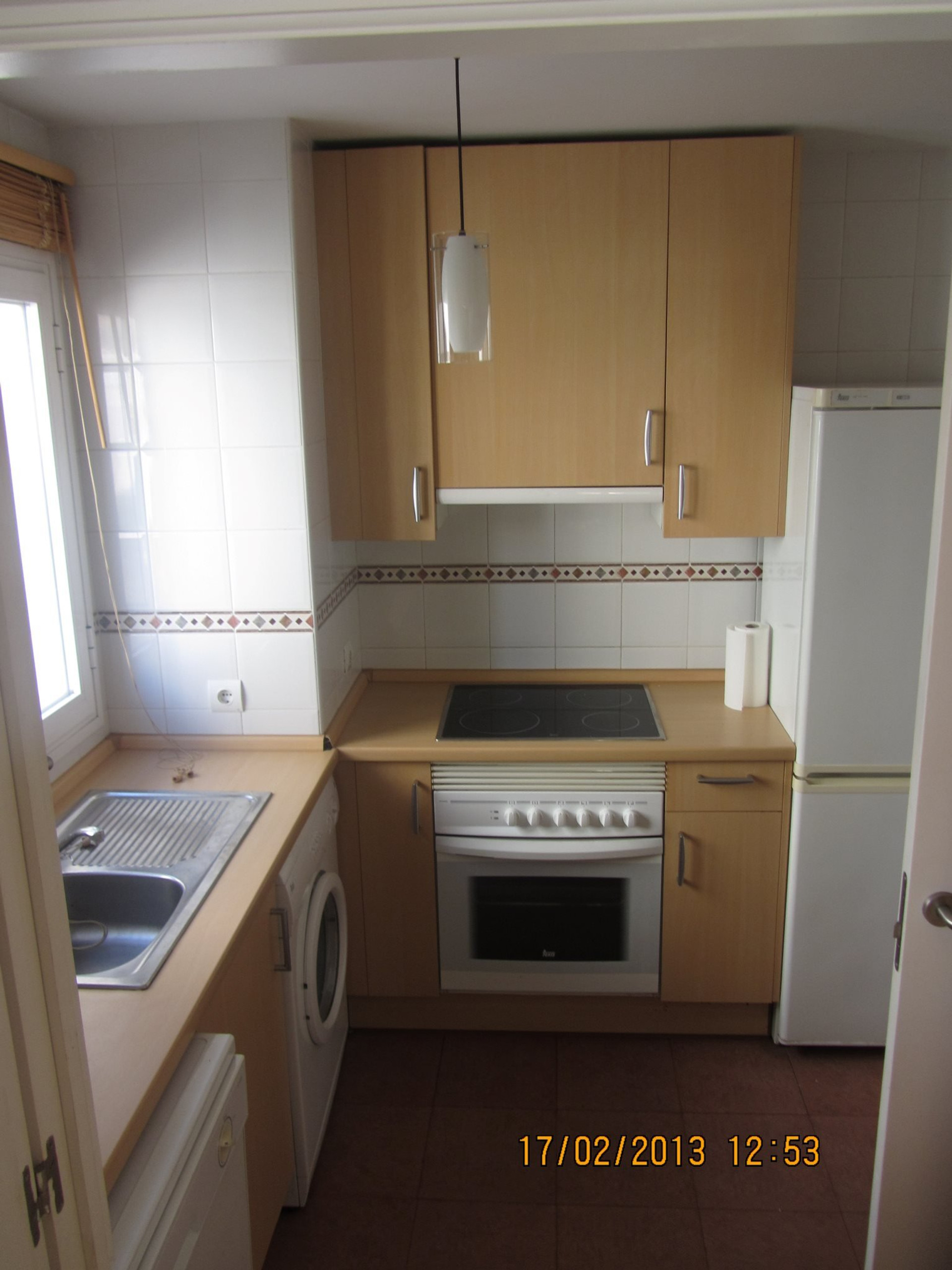 Kitchen with oven and fridge