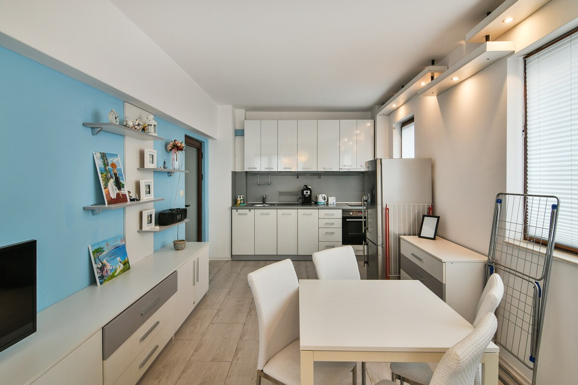 Bright and cozy bedroom with modern decor, air conditioning, and natural light. Perfect for a comfortable stay in Varna, offering a relaxing ambiance after a day of exploring the city or enjoying the nearby beaches