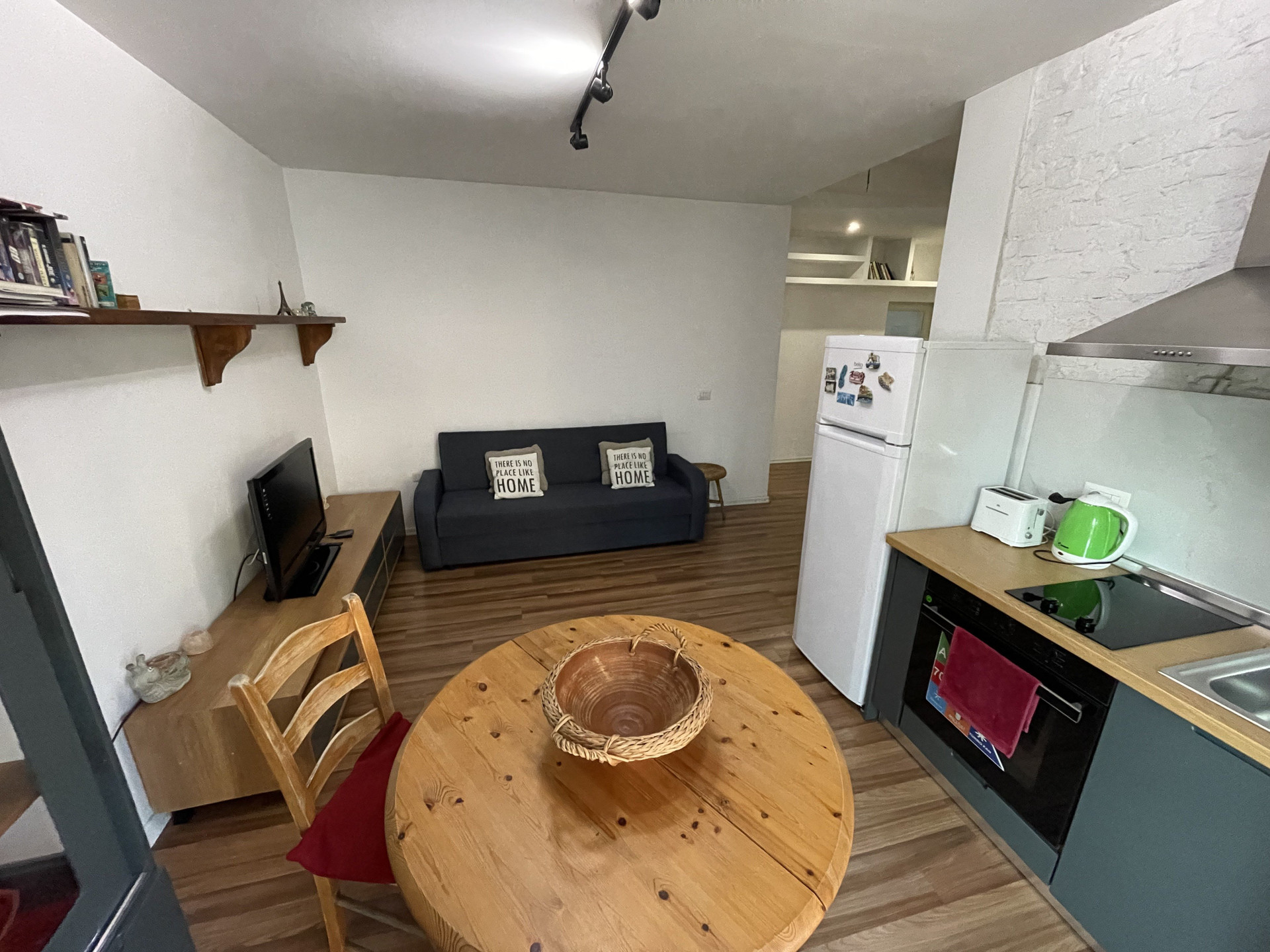 Living area, dining table, kitchenette