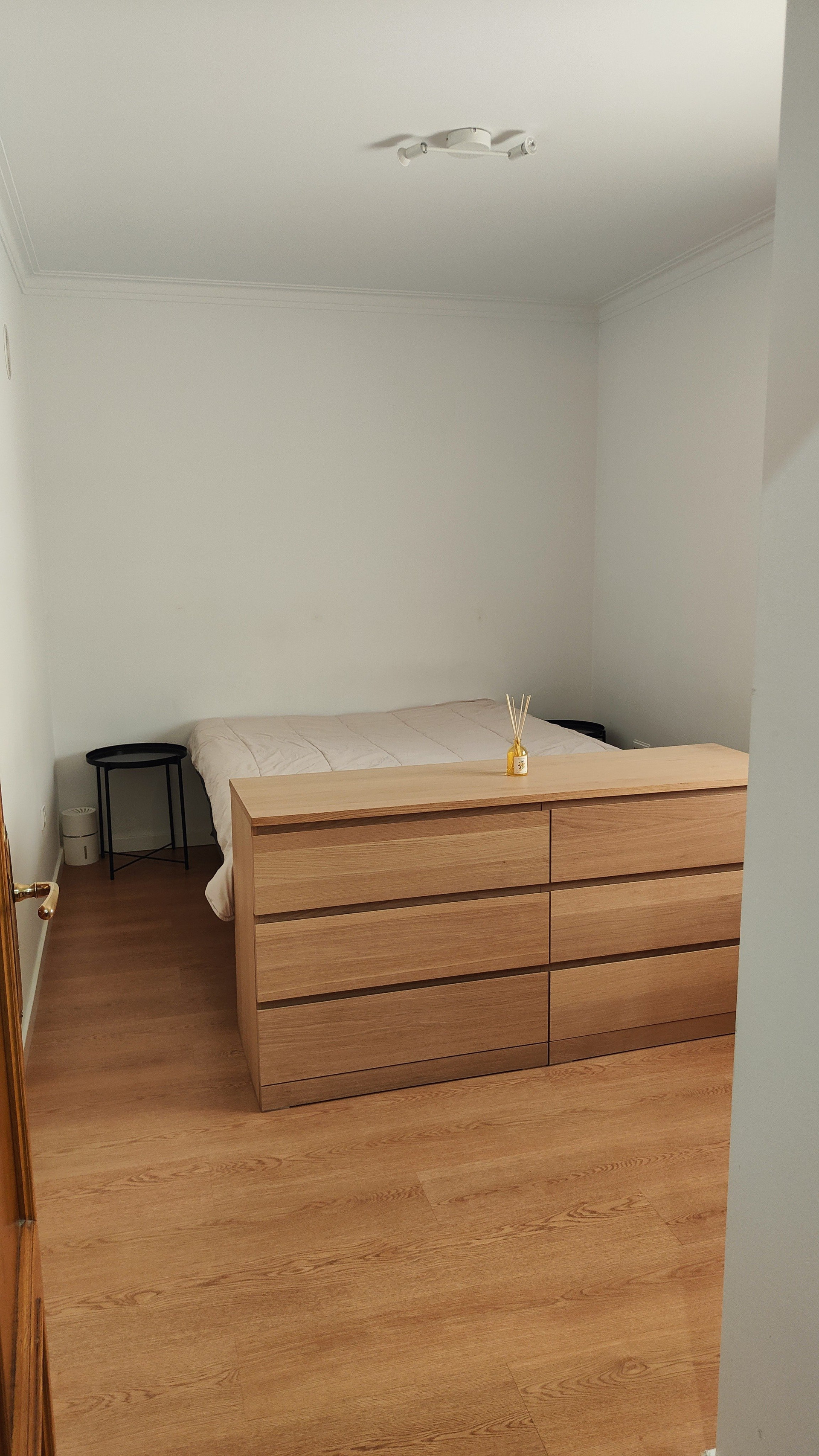 Bedroom with dresser and bed