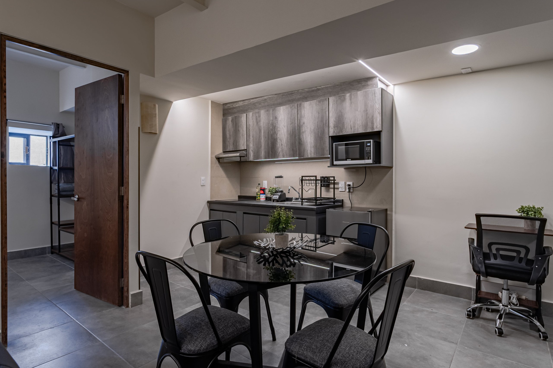 Kitchenette with dining table and office chair