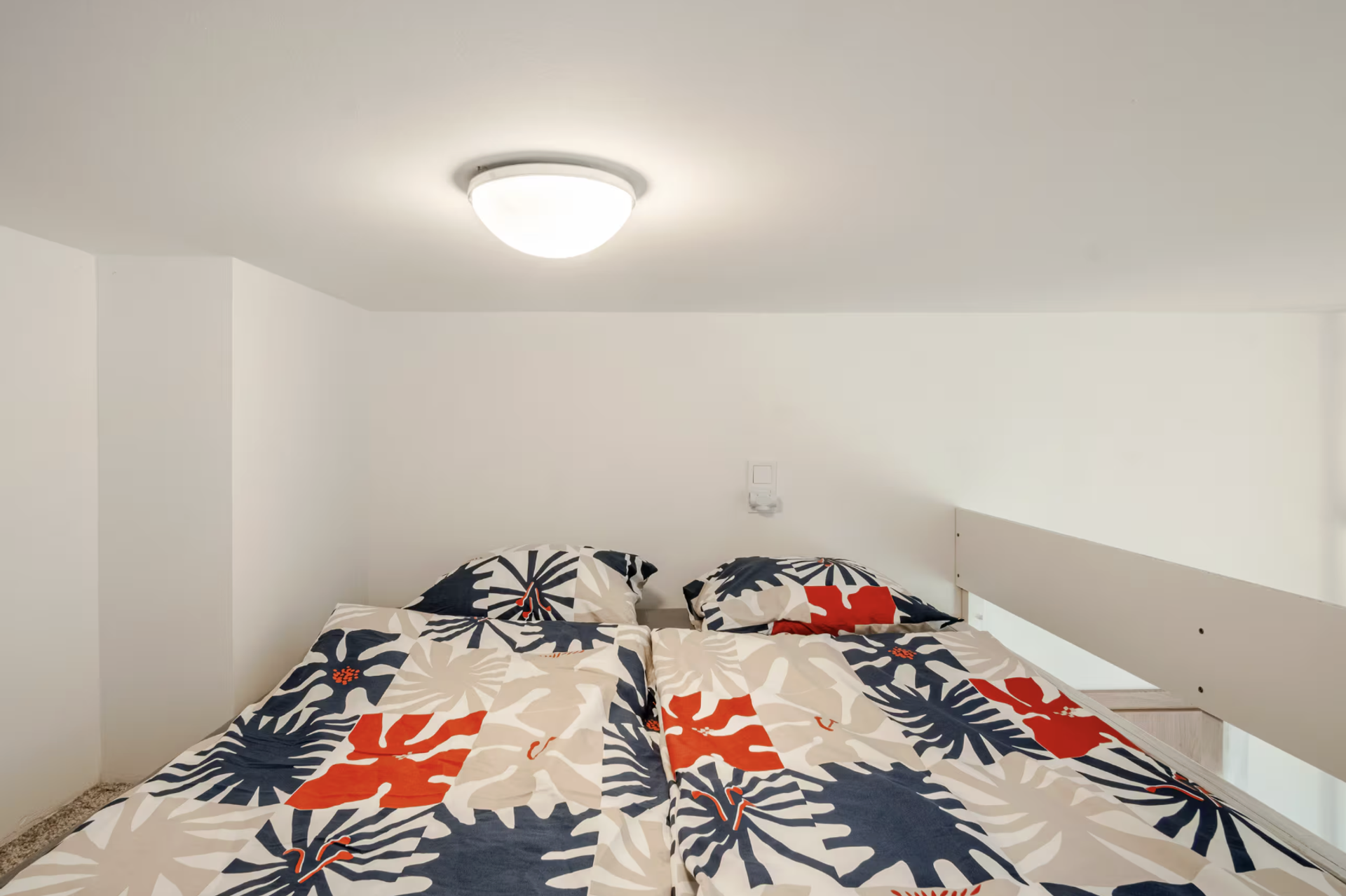 Loft bed with colorful bedding