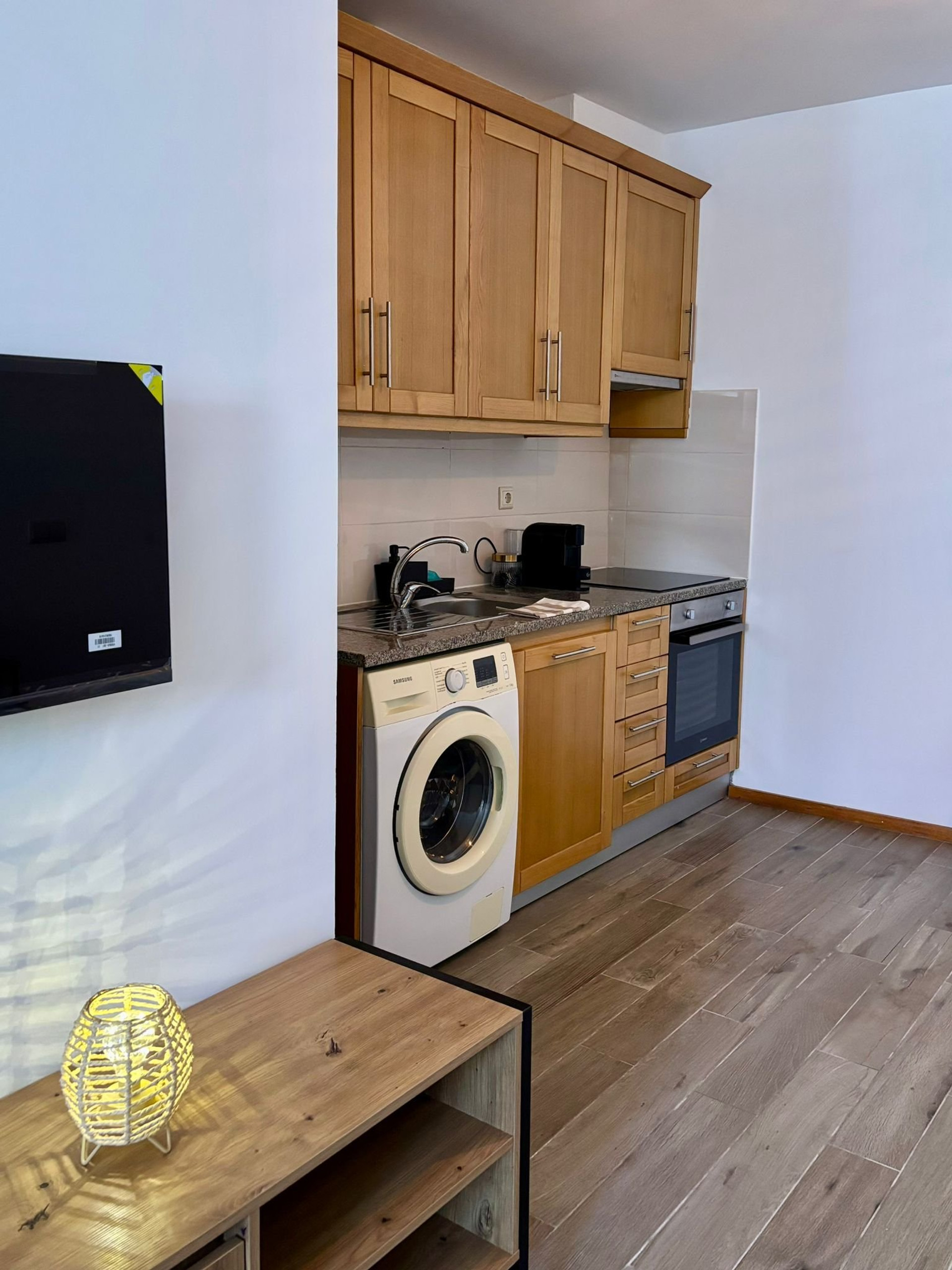 Kitchen with wooden cabinets washer