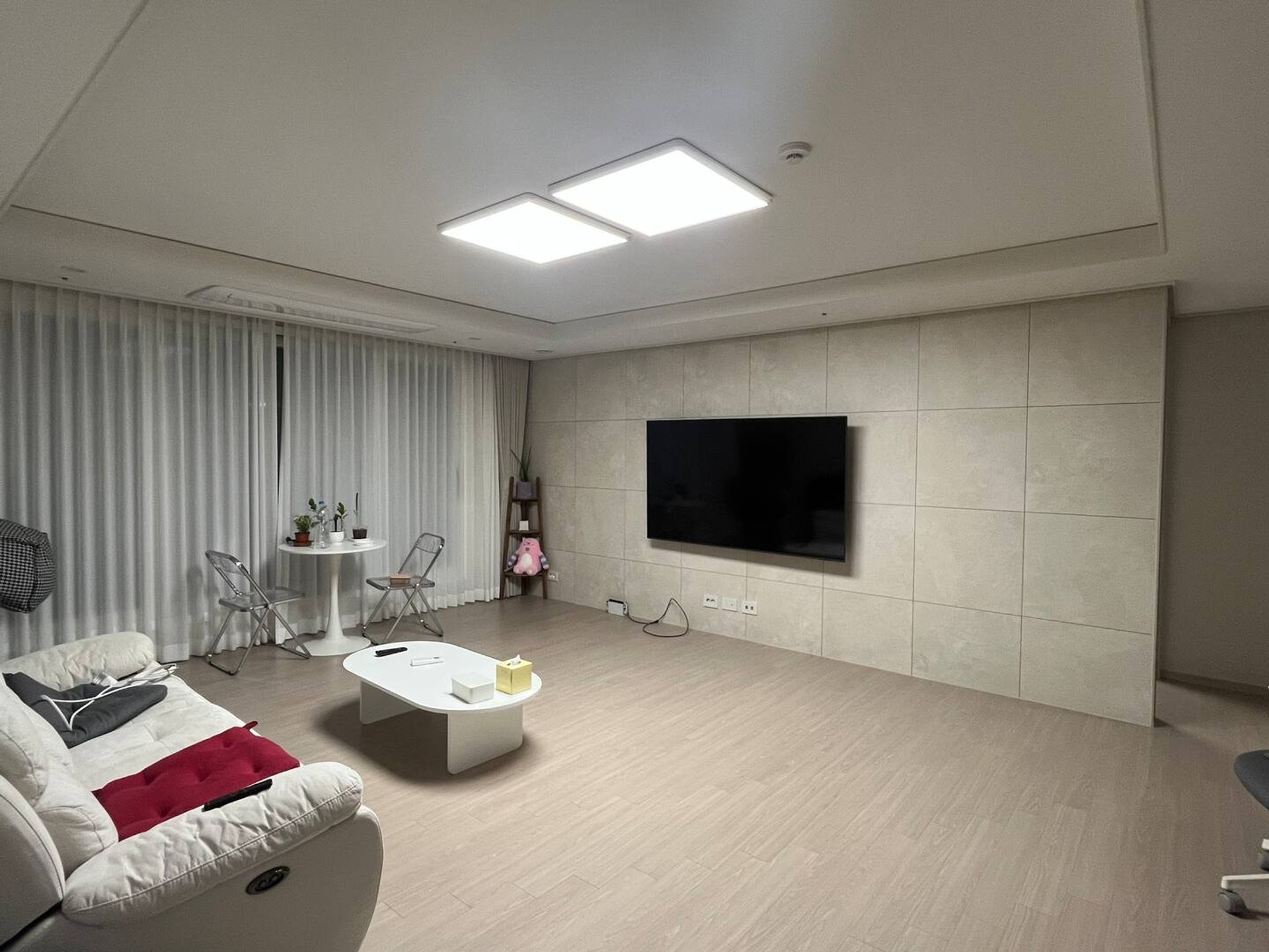 Spacious living room with TV wall
