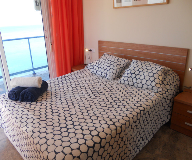 Bedroom with orange curtains