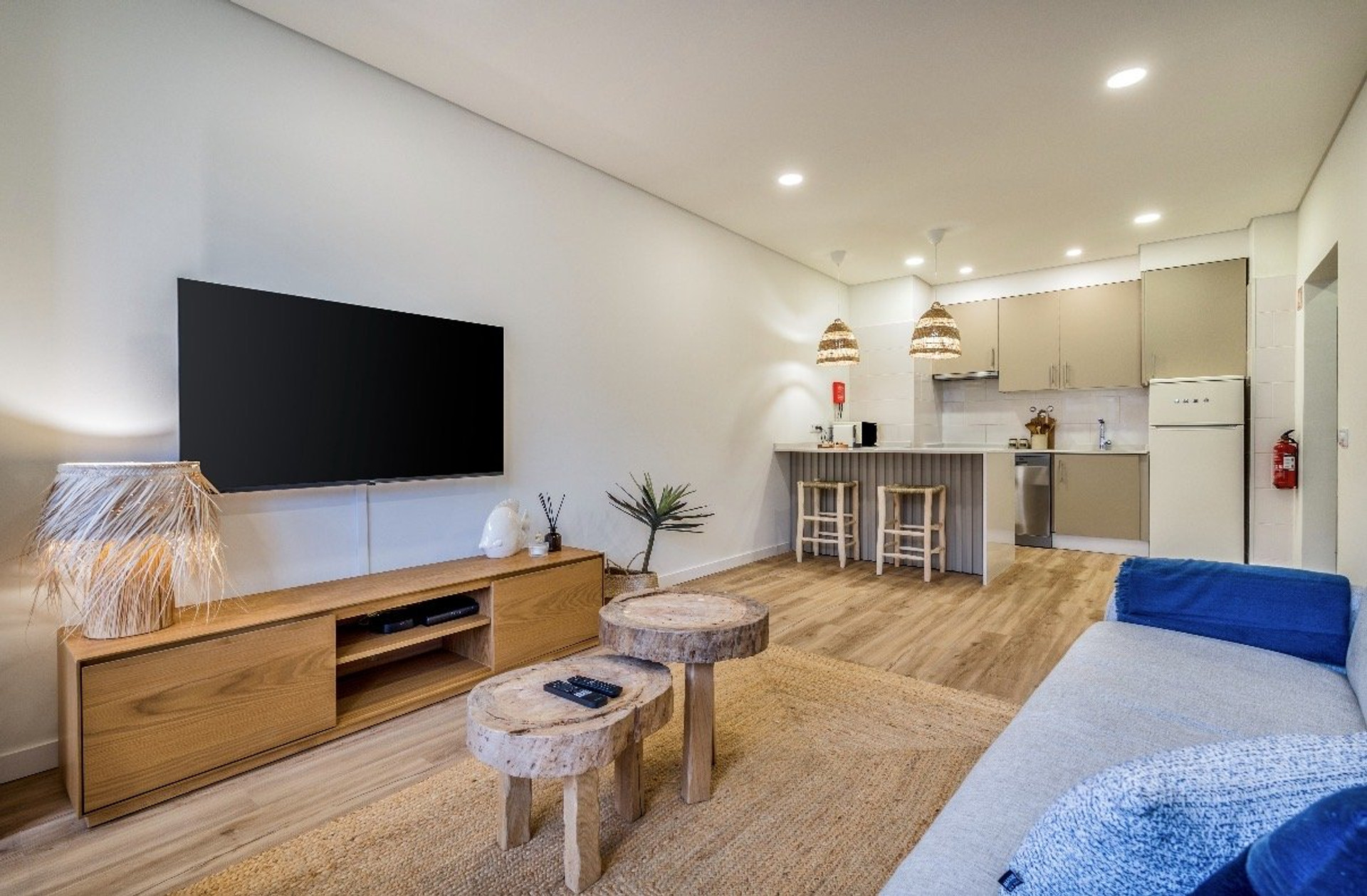 Living room with TV and kitchen