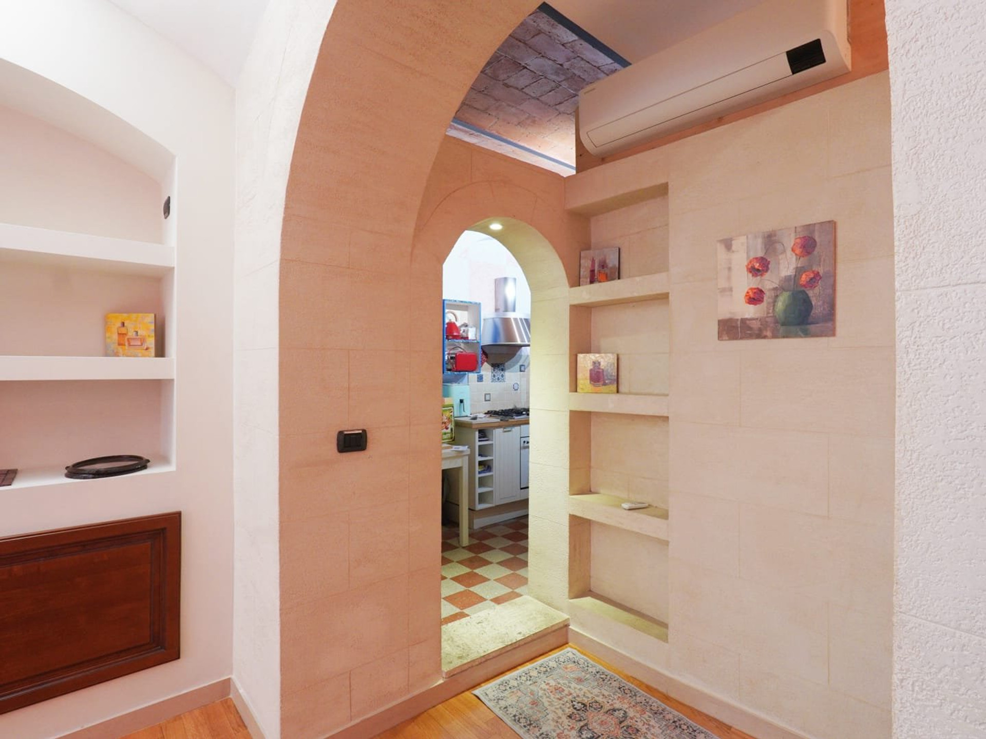 Hallway with vaulted arch entrance