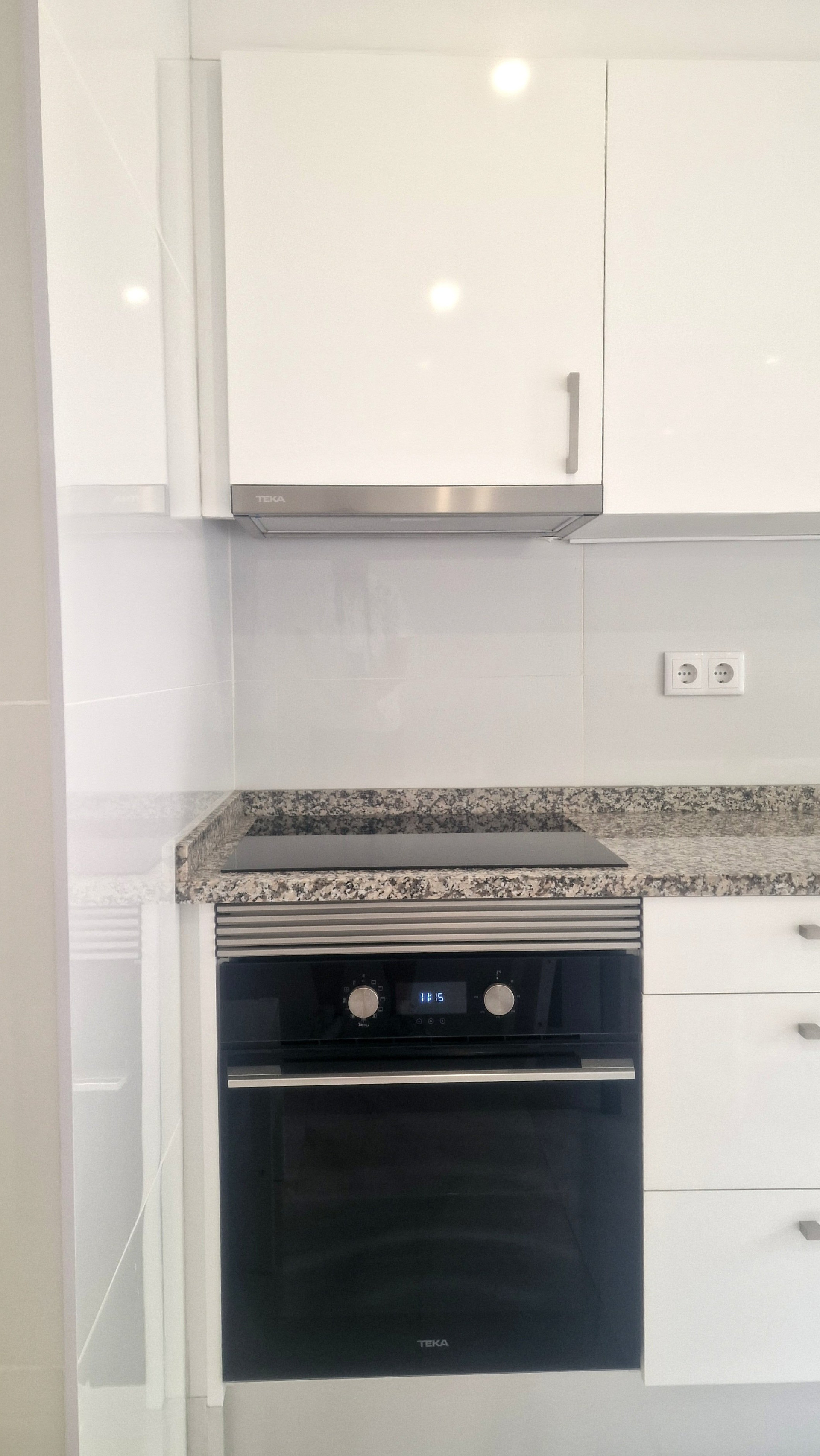 Kitchen with built-in oven and stove