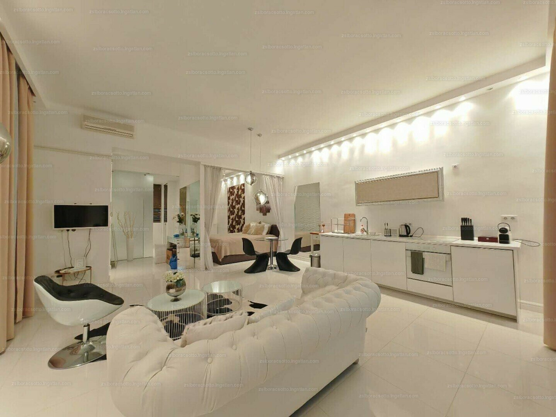 Living area with kitchen and bedroom
