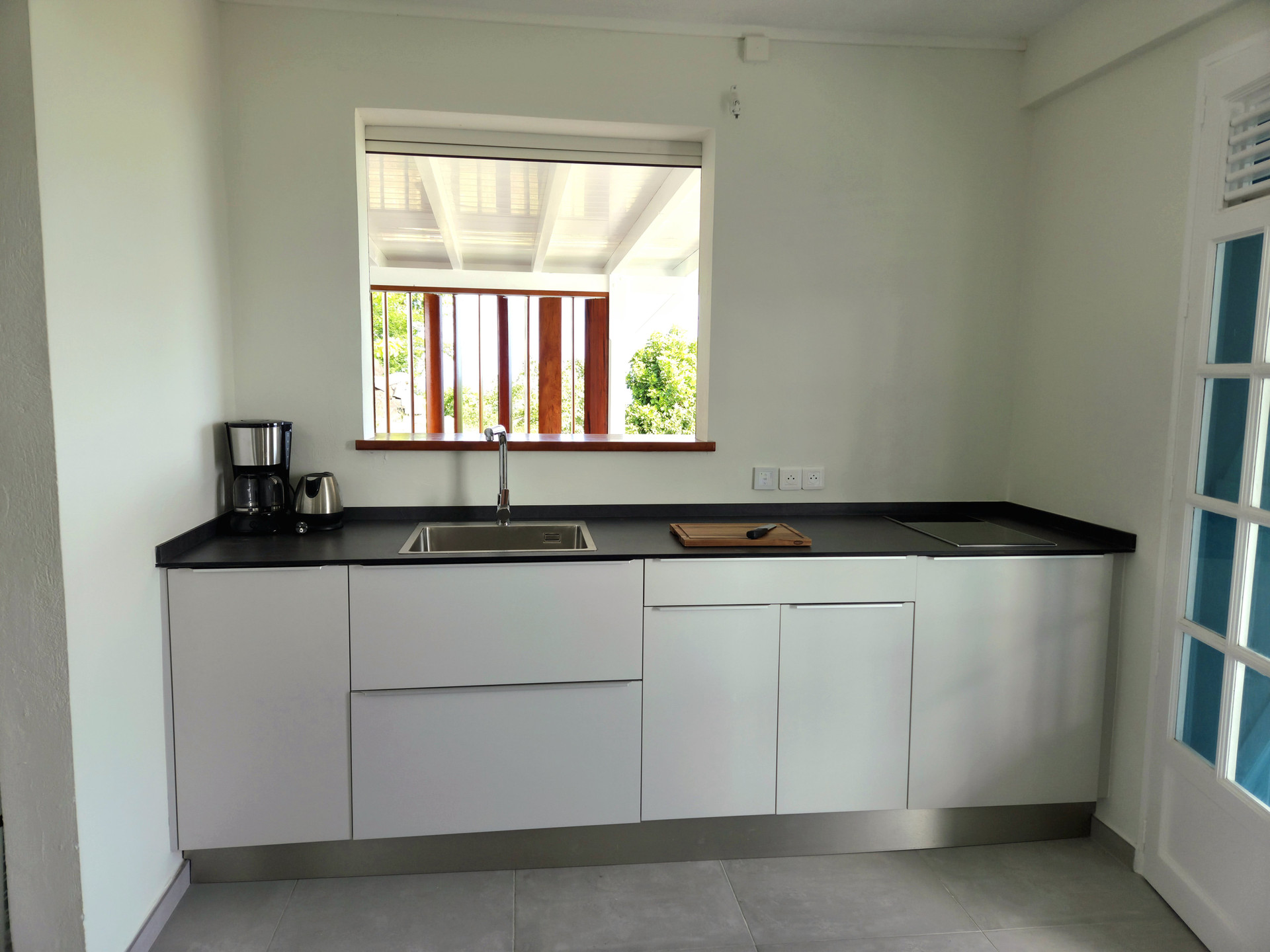 Modern white kitchen with sink