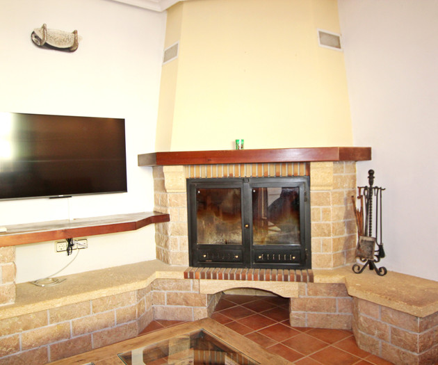 Living room fireplace with TV