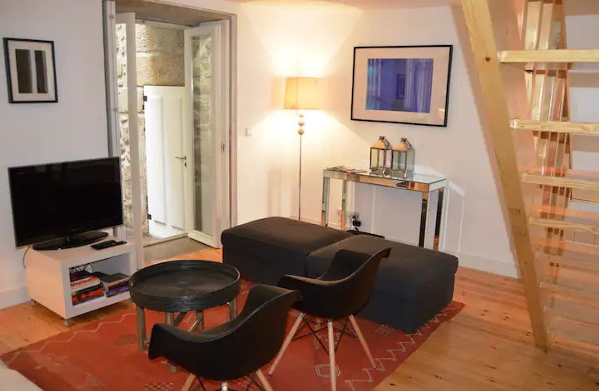 living room with stairs to the upper floor